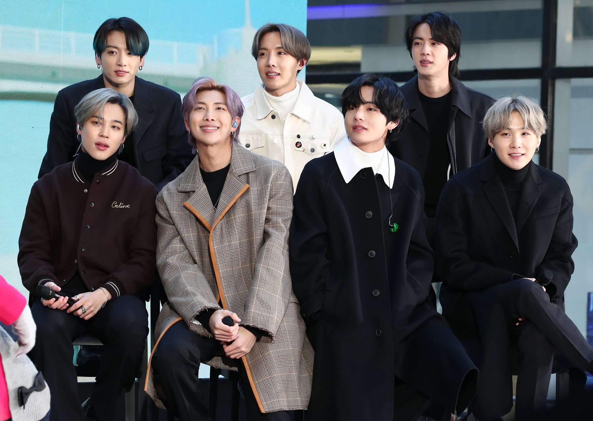 Jimin, Jungkook, RM, J-Hope, V, Jin, and SUGA of BTS sit on stage for the 'Today' Show at Rockefeller Plaza