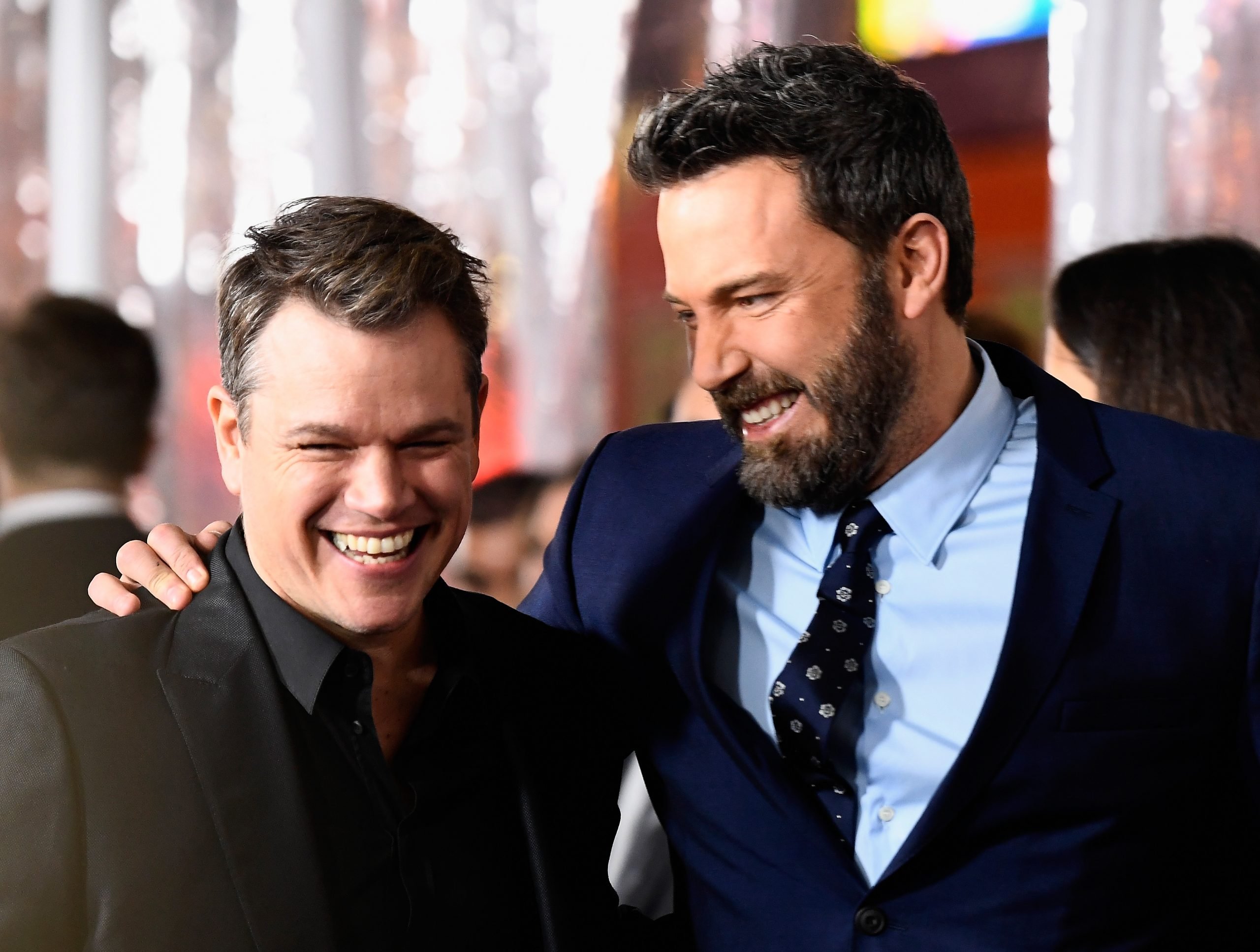 Ben Affleck puts his arm around Matt Damon