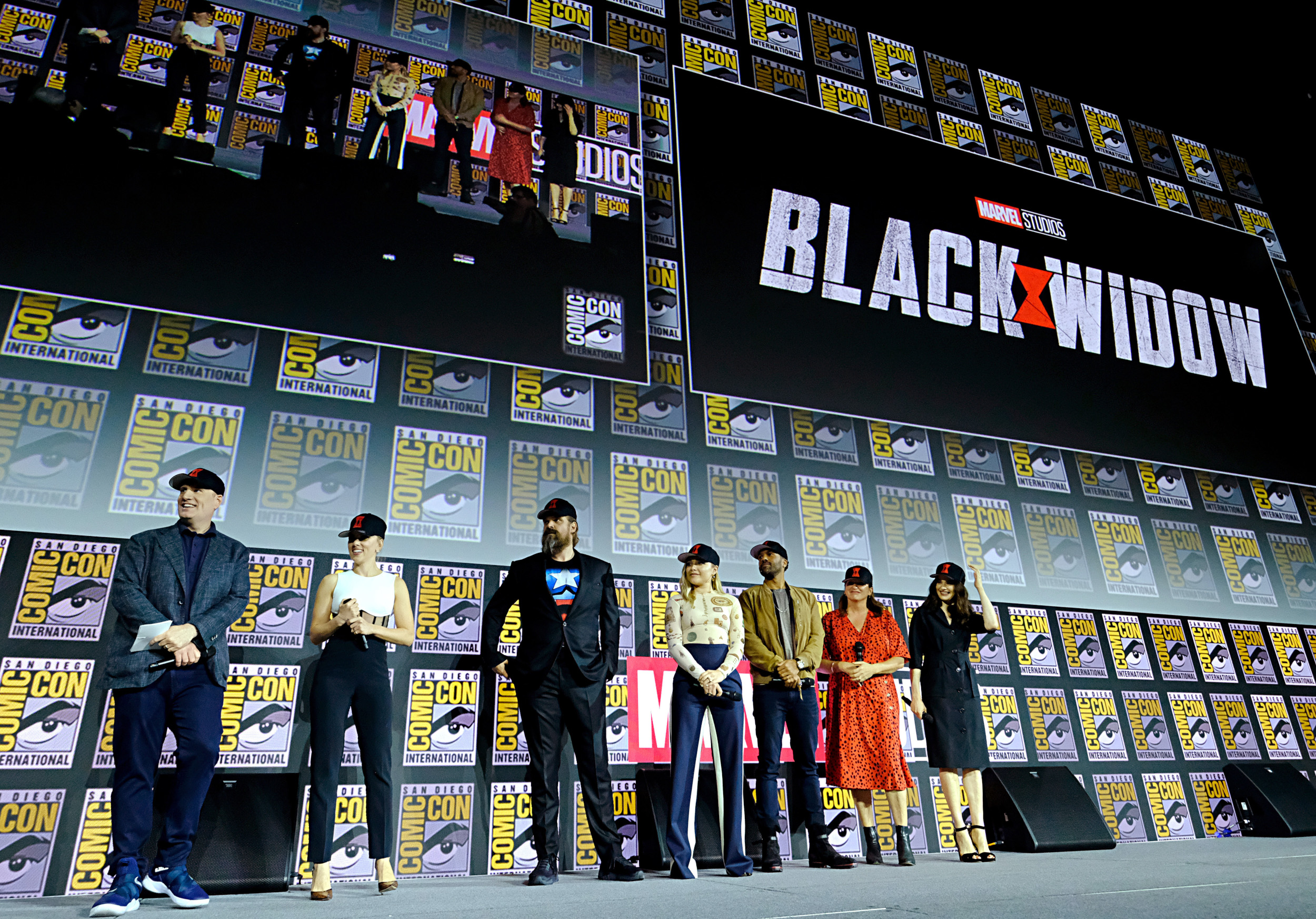 (L-R) President of Marvel Studios Kevin Feige, Scarlett Johansson, David Harbour, Florence Pugh, O-T Fagbenle, Director Cate Shortland and Rachel Weisz of Marvel Studios' 'Black Widow' stand on-stage at Comic-Con