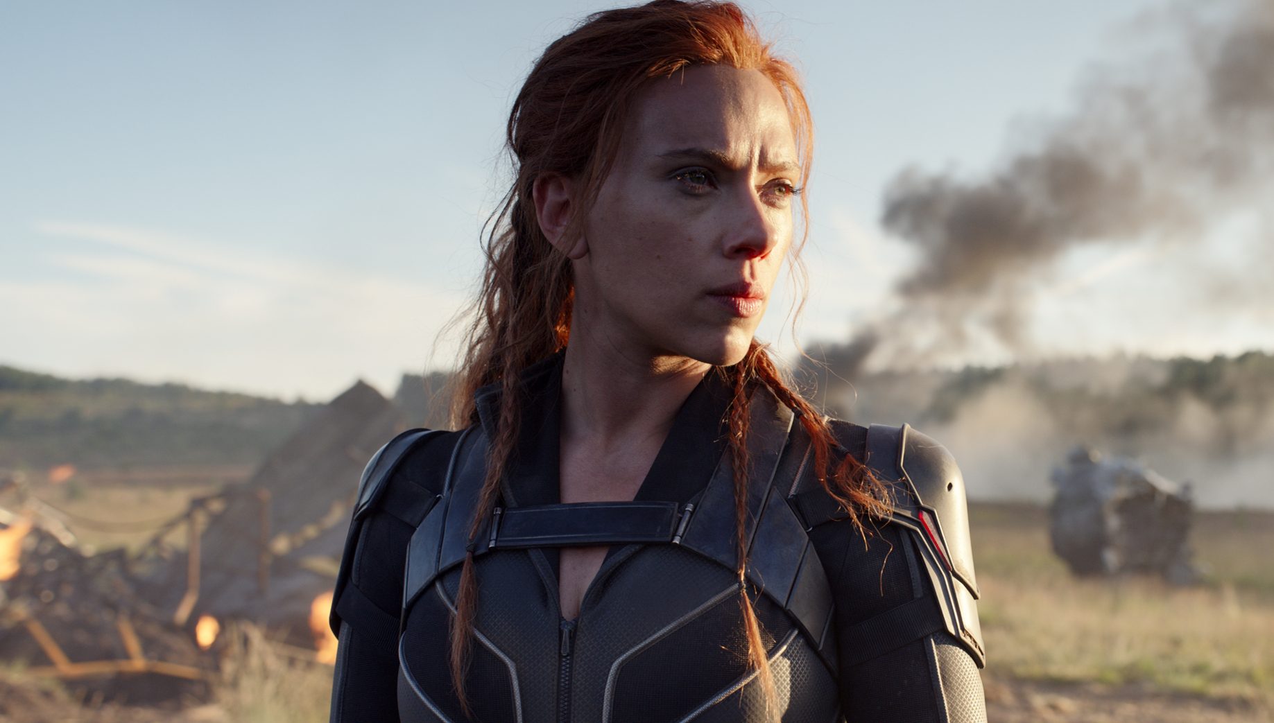 'Black Widow' star Scarlett Johansson as Natasha Romanoff standing in front of smoke