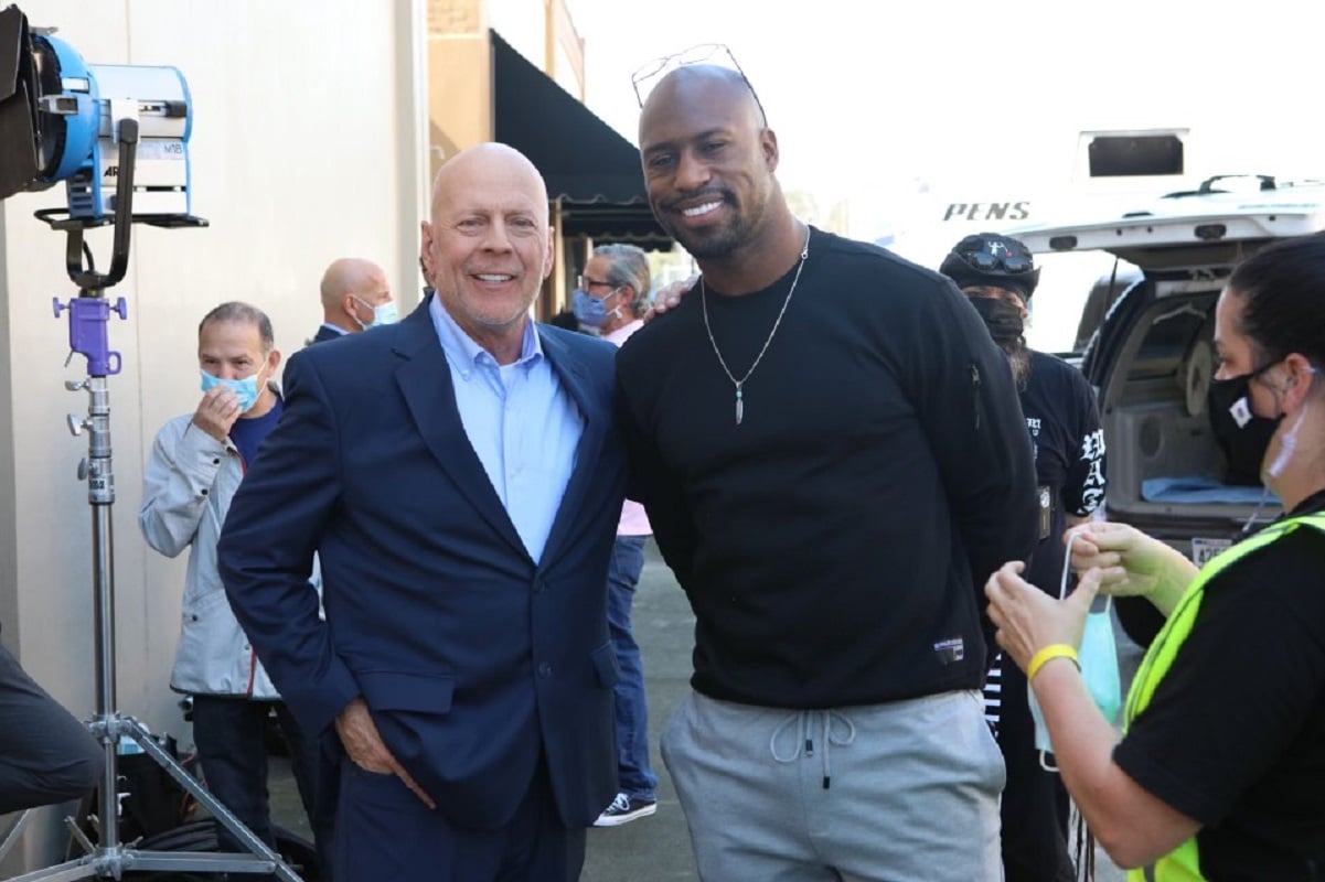 Bruce Willis and Vernon Davis pose for photo on the set of 'Gasoline Alley'