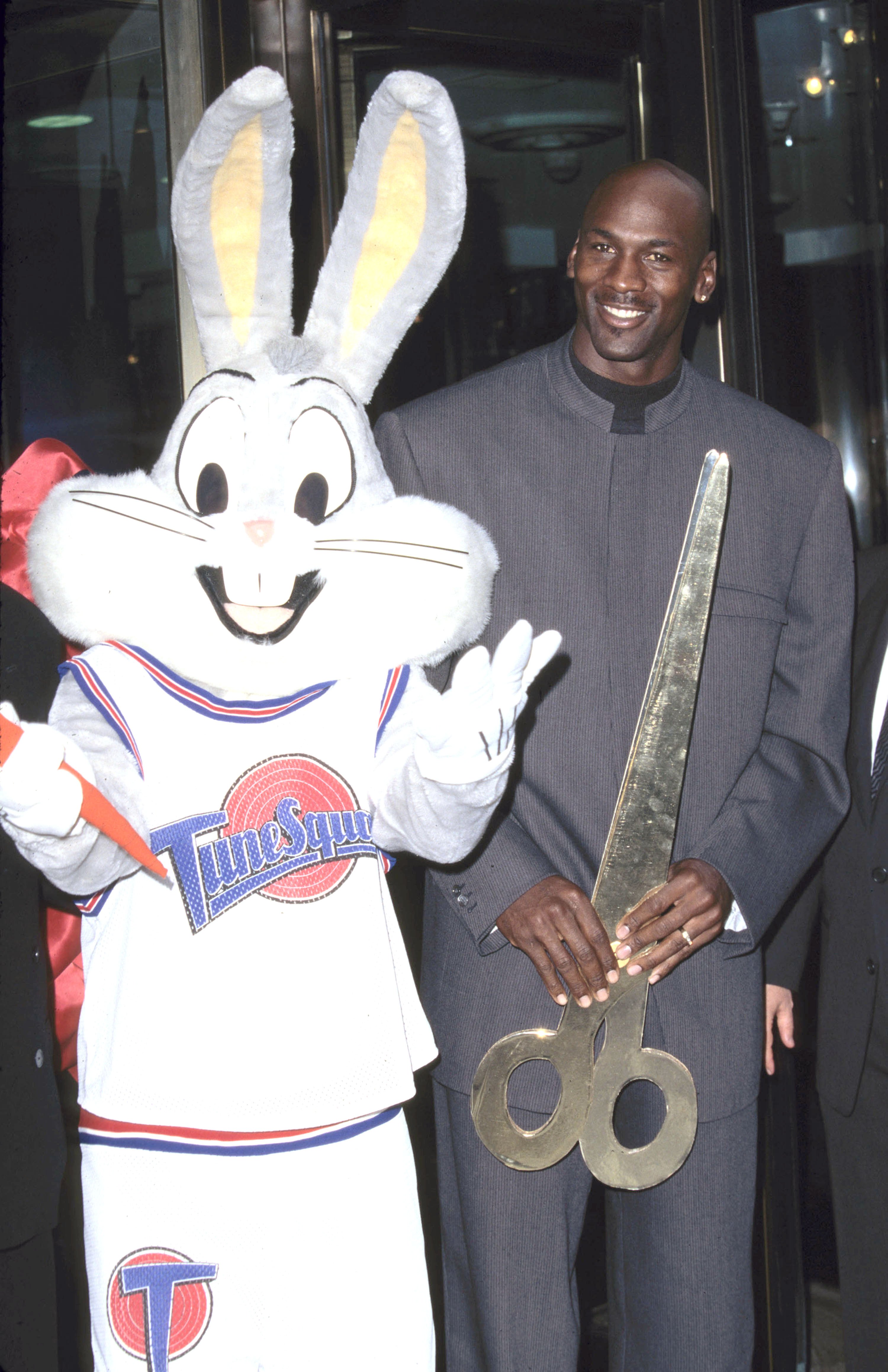 Bugs Bunny and Michael Jordan pose for photo at Warner Bros. Ribbon cutting ceremony for NYC store opening in 1996