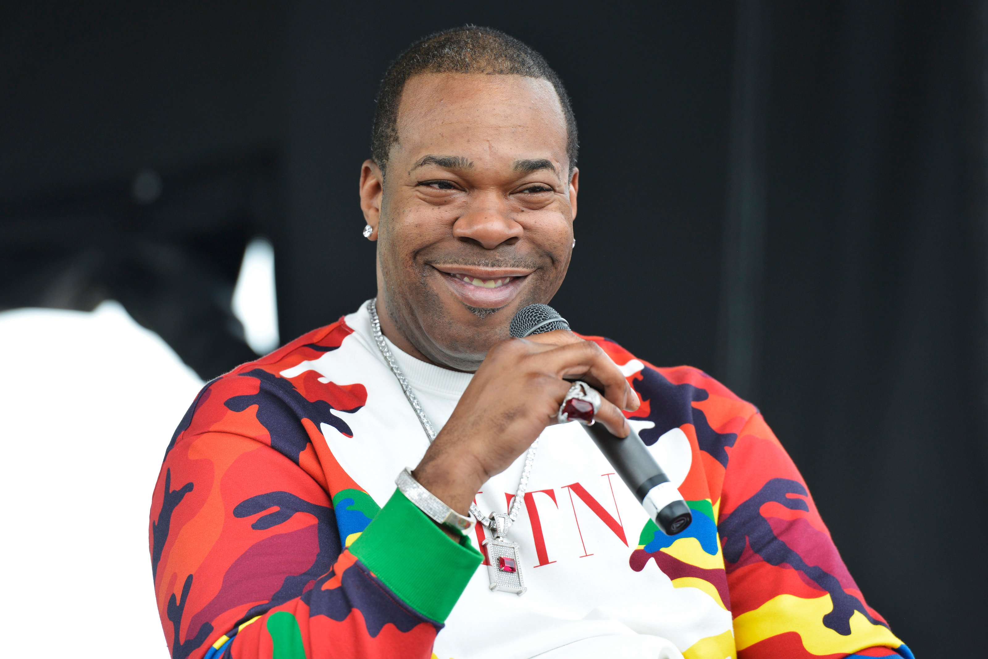 Busta Rhymes speaking on a mic