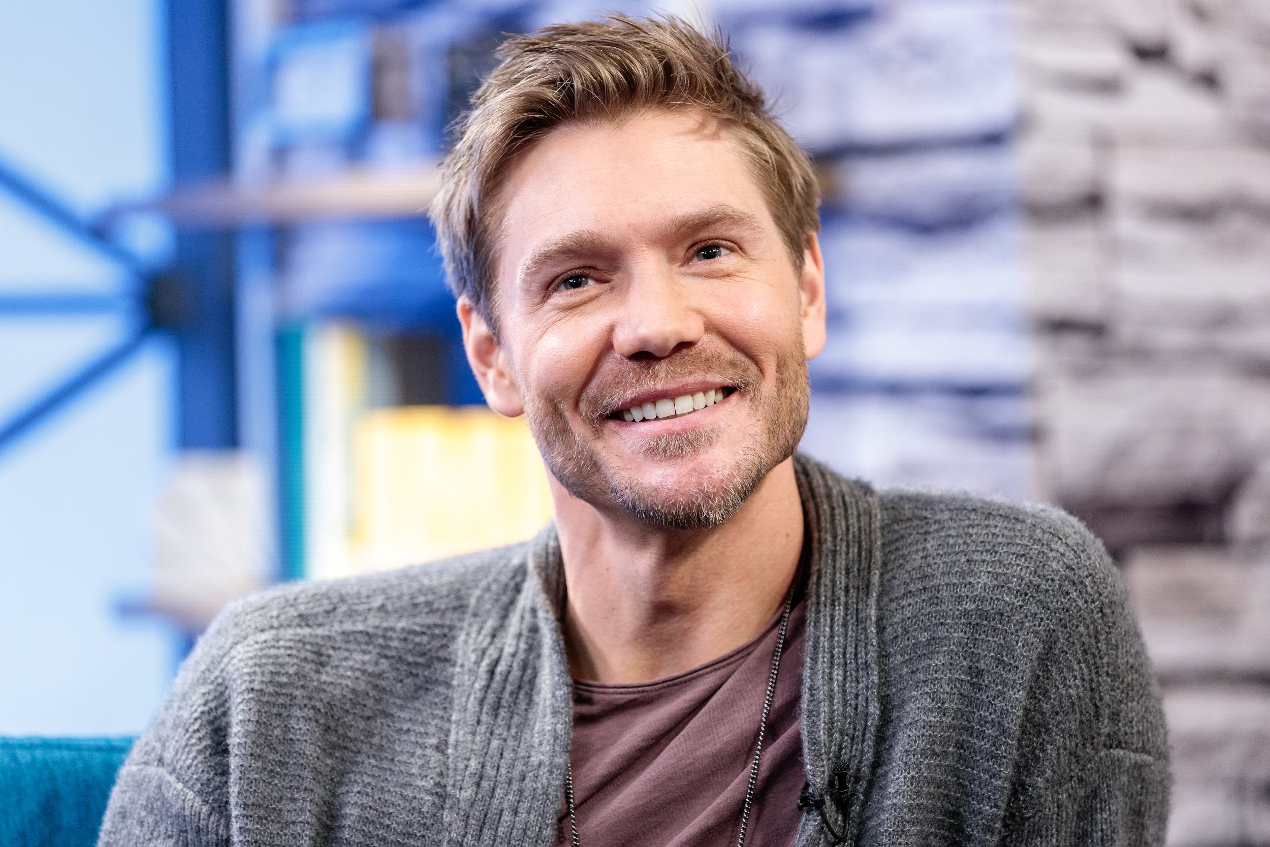 'Gilmore Girls' alum Chad Michael Murray wearing a grey sweater and smiling