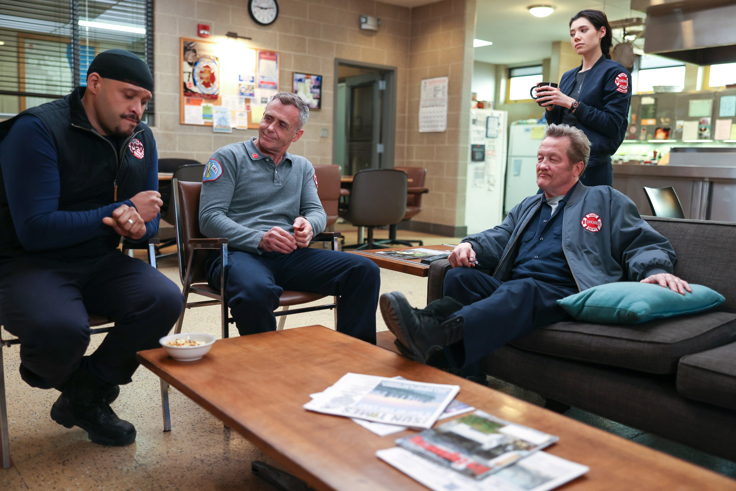 The Chicago Fire cast sits in the fire house and talks.