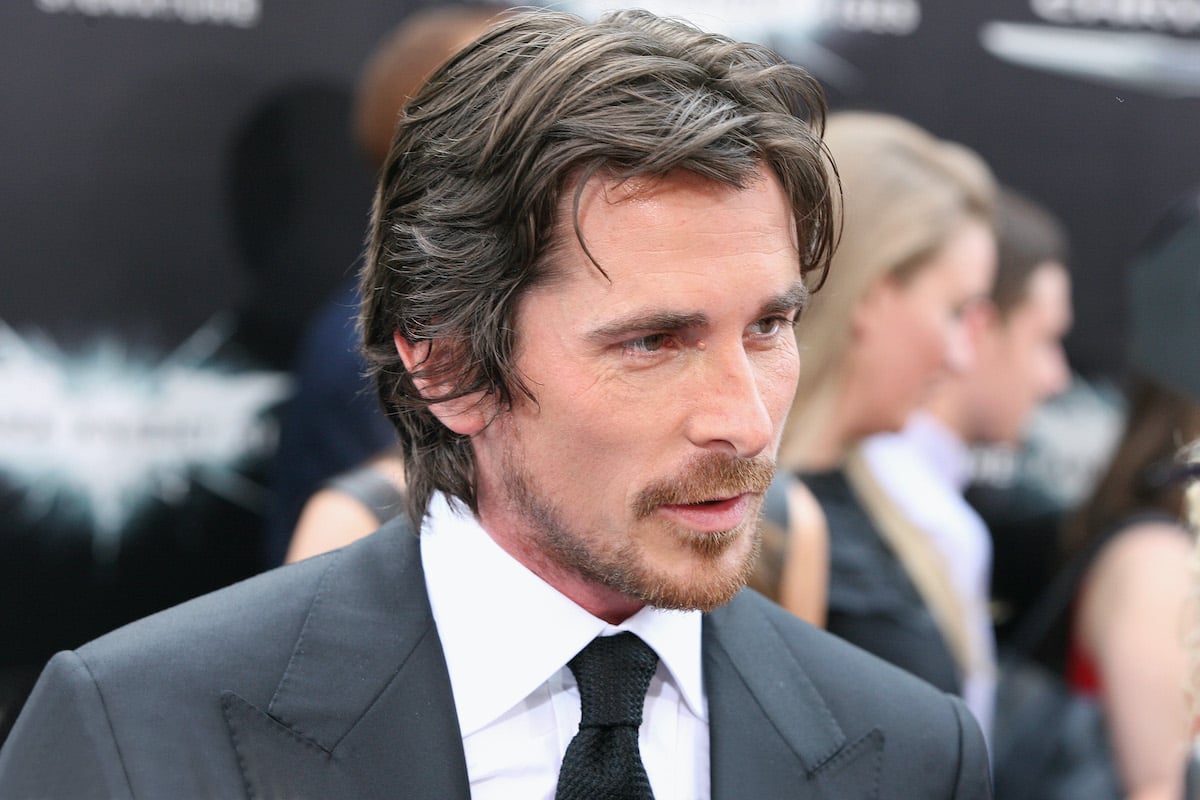 Christian Bale wears a suit at ‘The Dark Knight Rises’ premiere