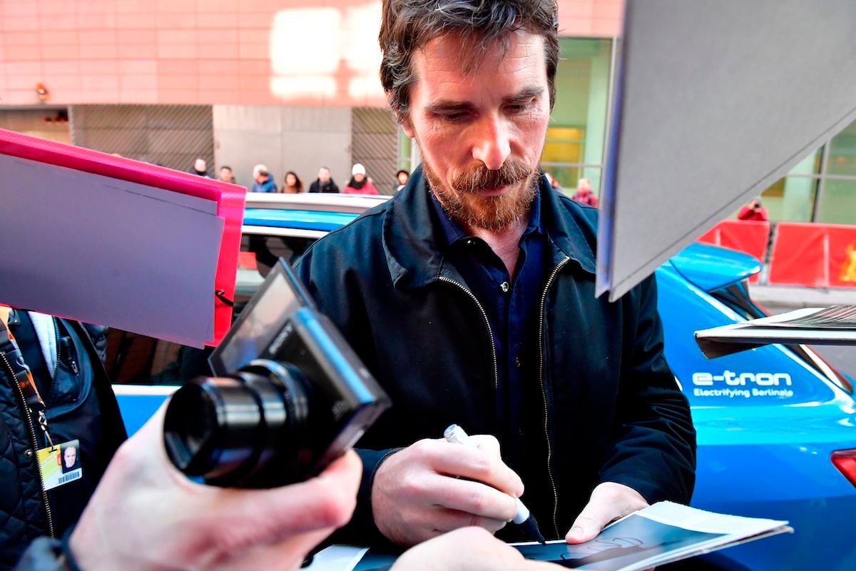 Christian Bale signs autographs for fans