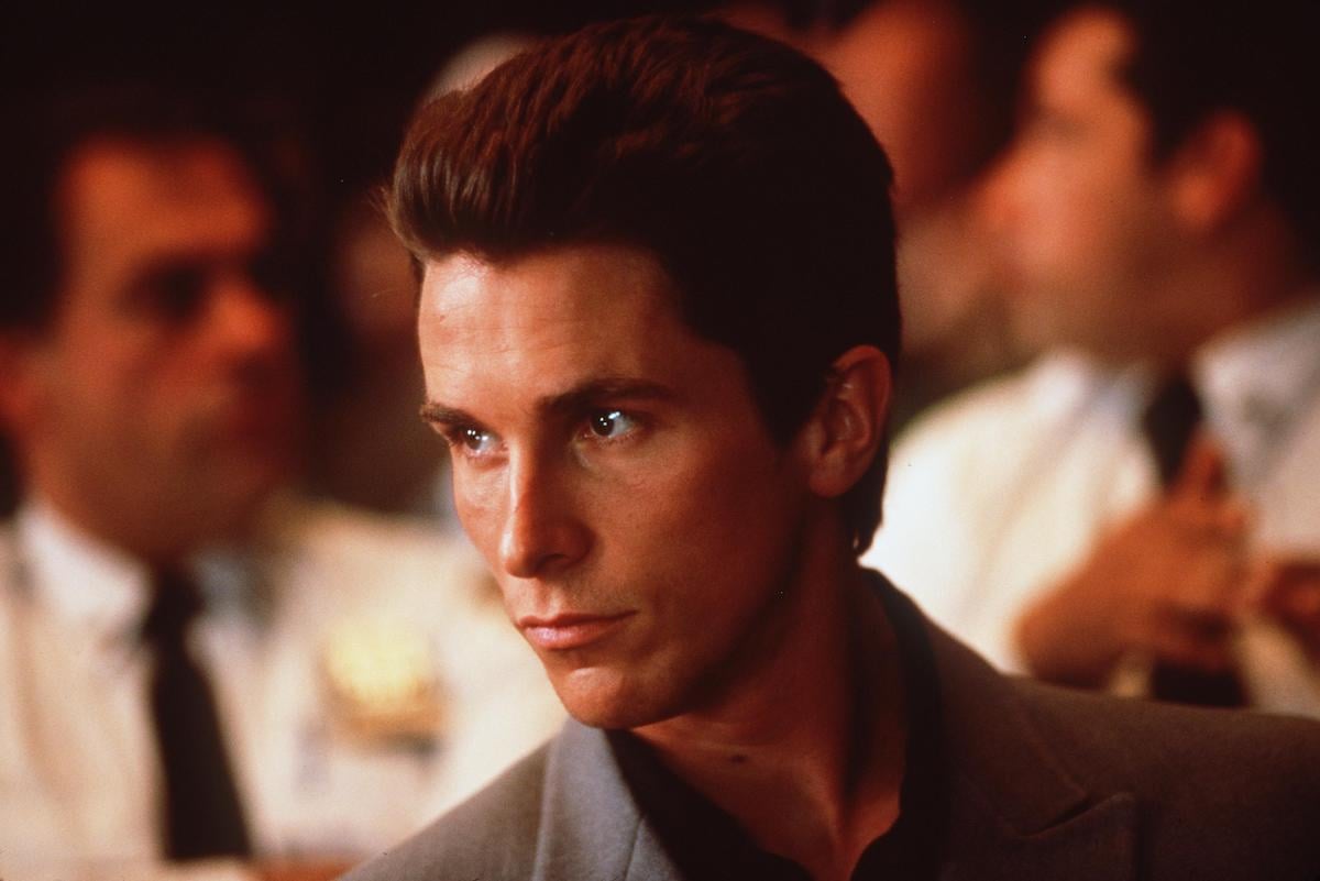 Christian Bale wears a suit and looks off into the distance in scene from the 2000 movie ‘Shaft’