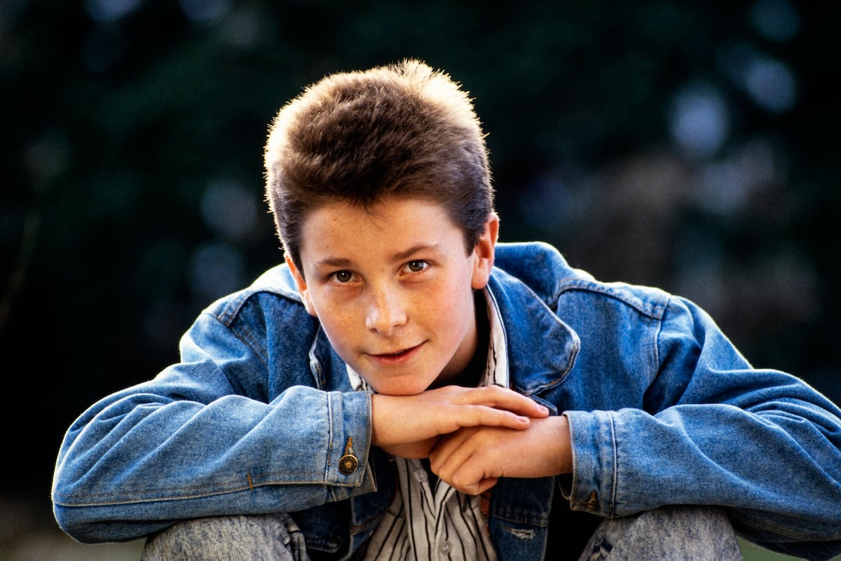 Christian Bale wears a denim jacket at home in 1987