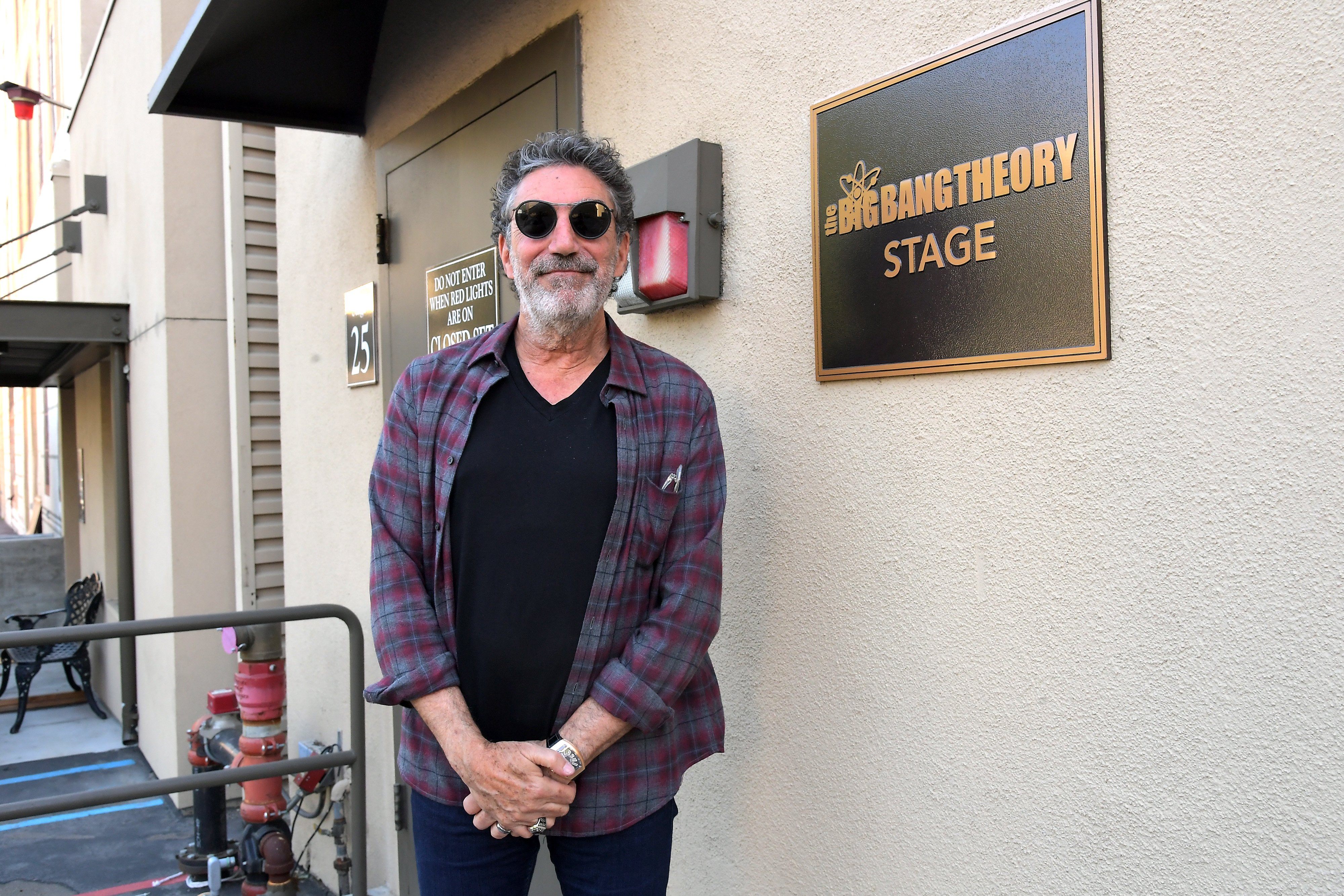 Chuck Lorre stands in front of the sign for the 'The Big Bang Theory' Set at Warner Bros. Studio
