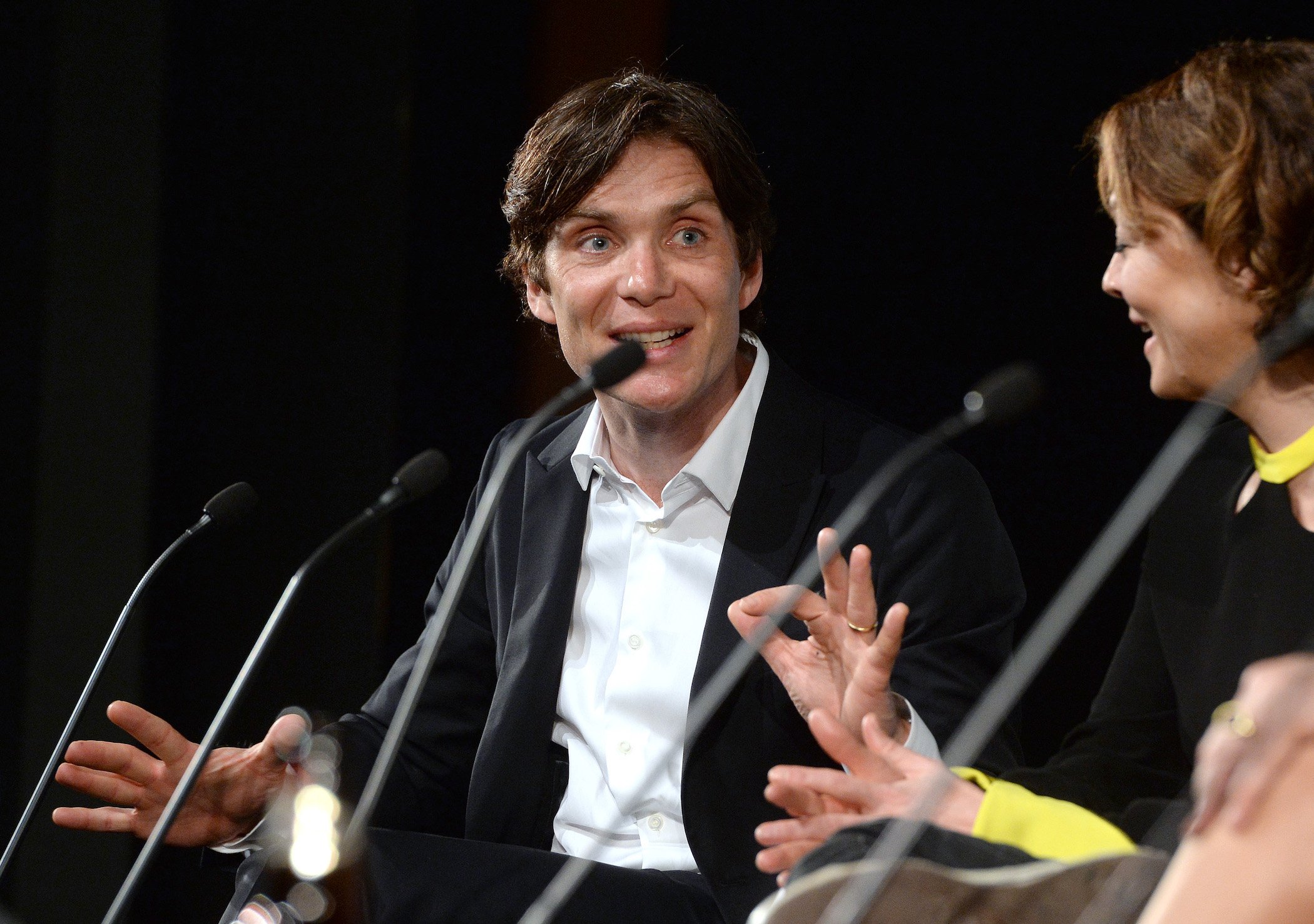 Cillian Murphy, Thomas Shelby in 'Peaky Blinders' Season 6, smiling during a Q&A for the second season of the show