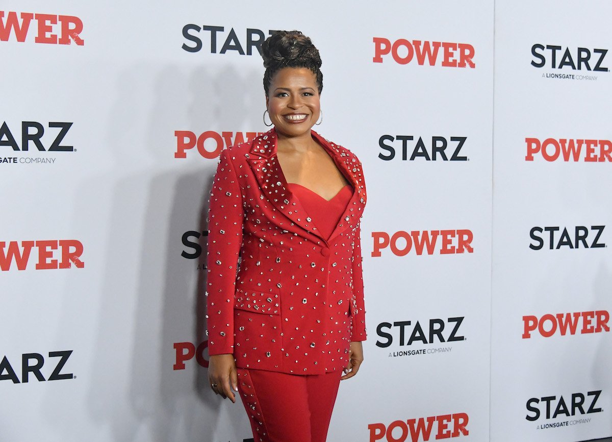 Courtney Kemp Agboh attends the "Power" premiere in a red suit