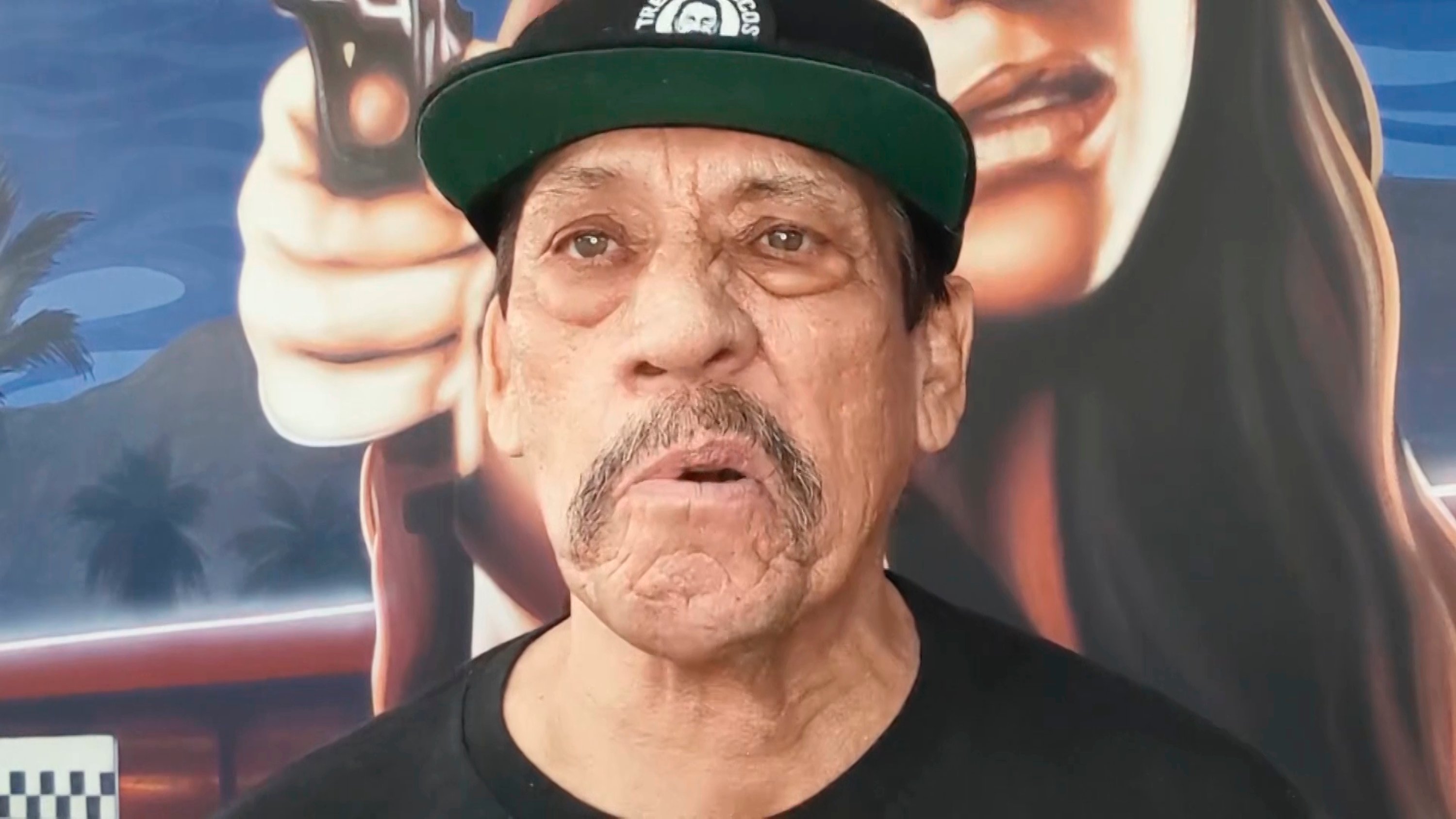 A close-up of Danny Trejo in a hat during the May 9, 2020 episode of 'Saturday Night Live'