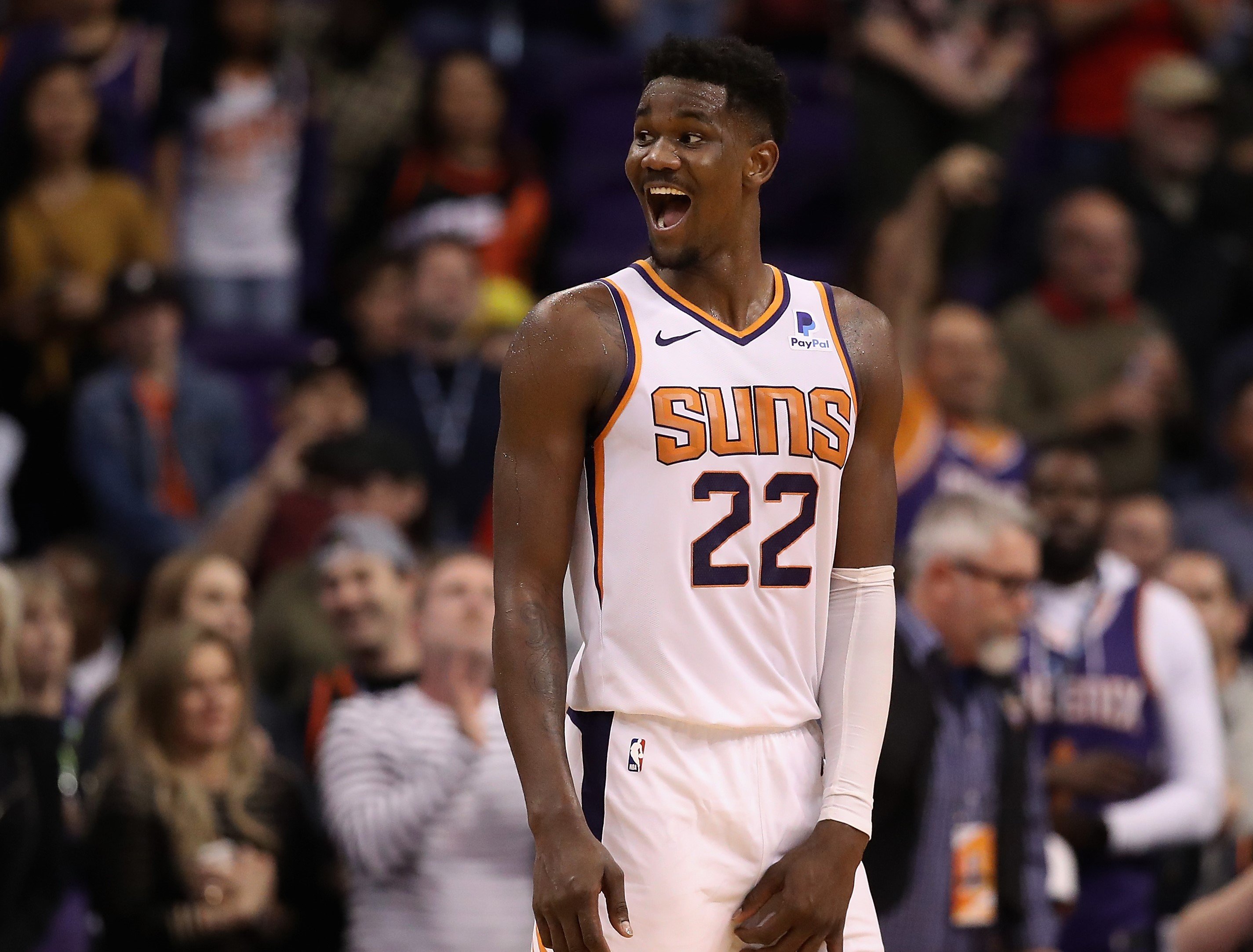 Deandre Ayton smiling during the final moments of the NBA game against the Milwaukee Bucks