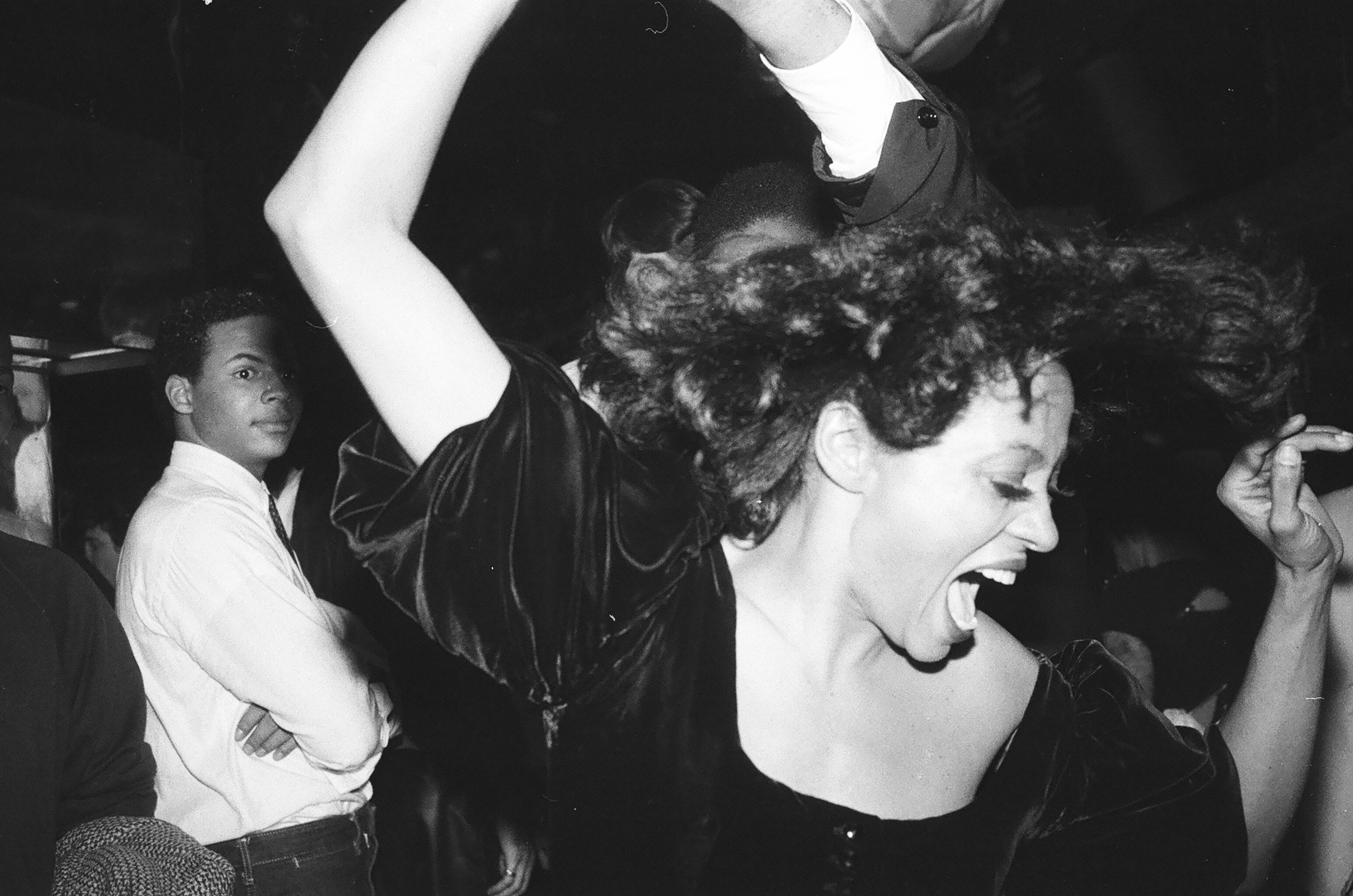Diana Ross wearing a black top and lipstick at Studio 54.