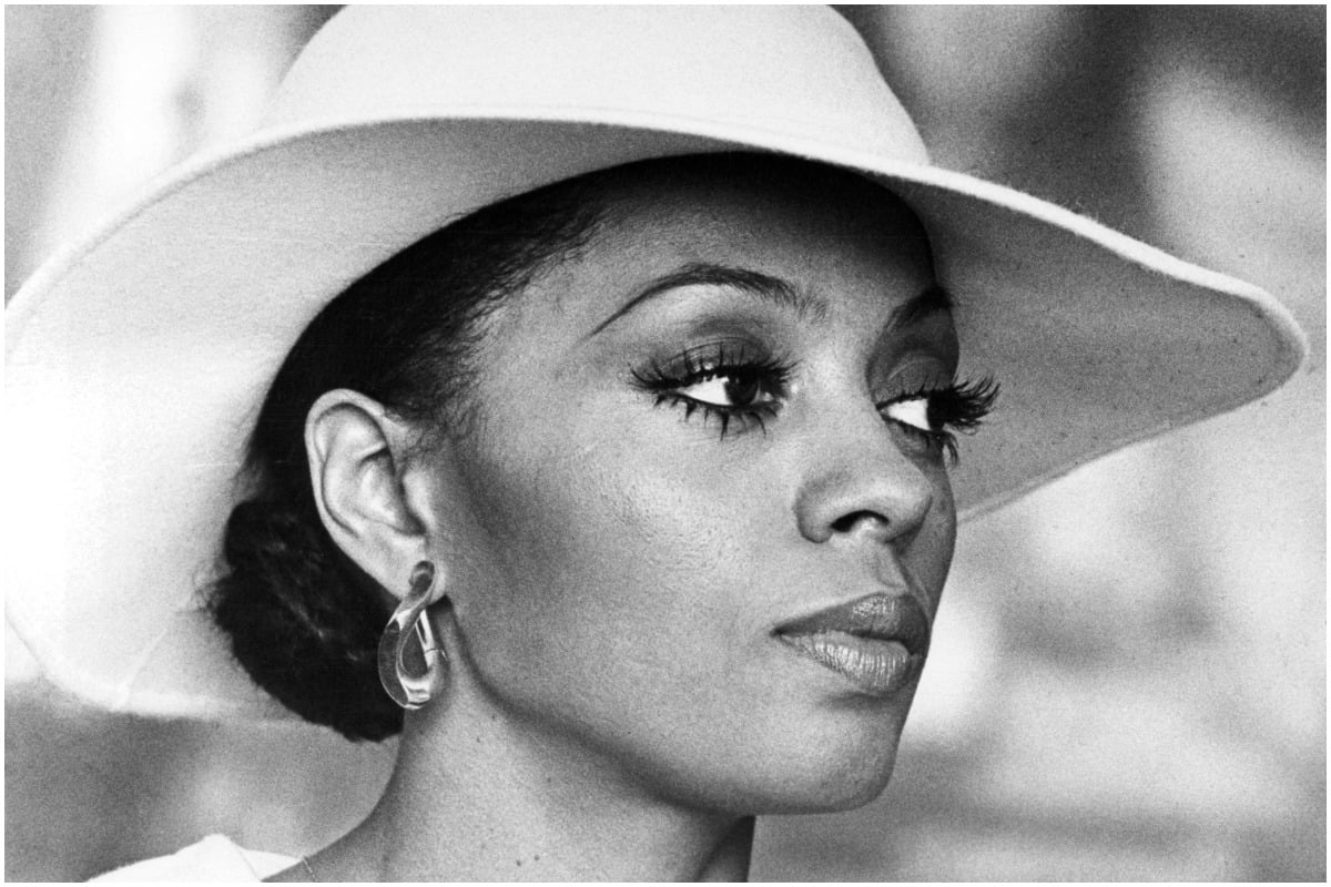 Diana Ross staring intensely while filming a scene as Tracy Chambers in 'Mahogany'