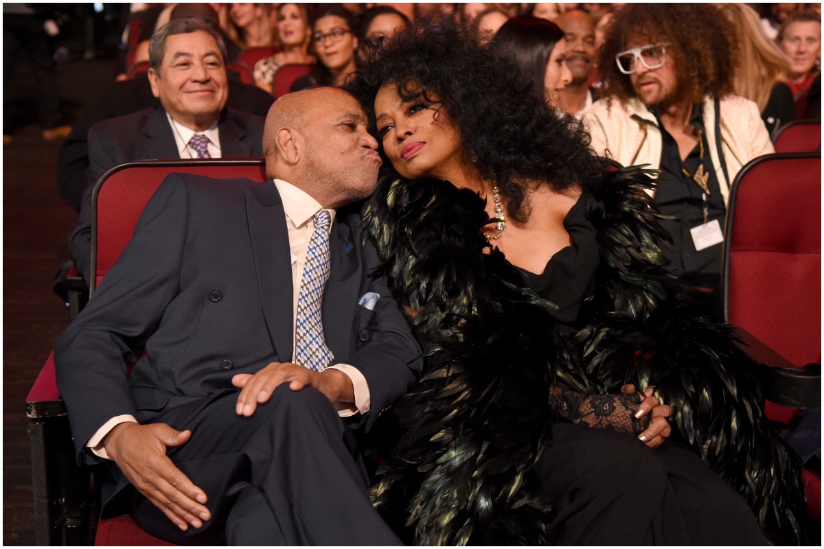 Diana Ross and Berry Gordy kissing at an awards show.