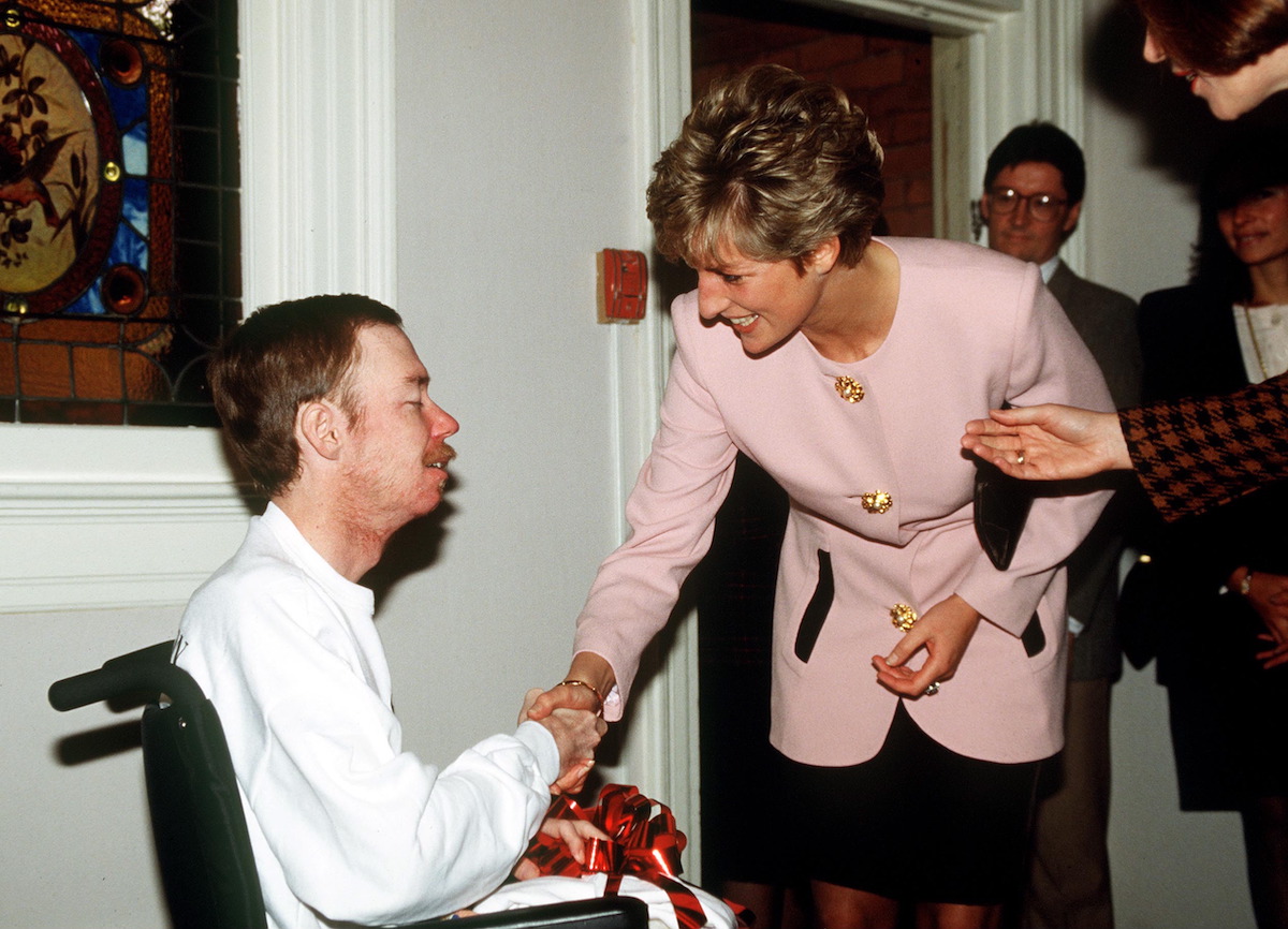 Diana shakes hands with a patient