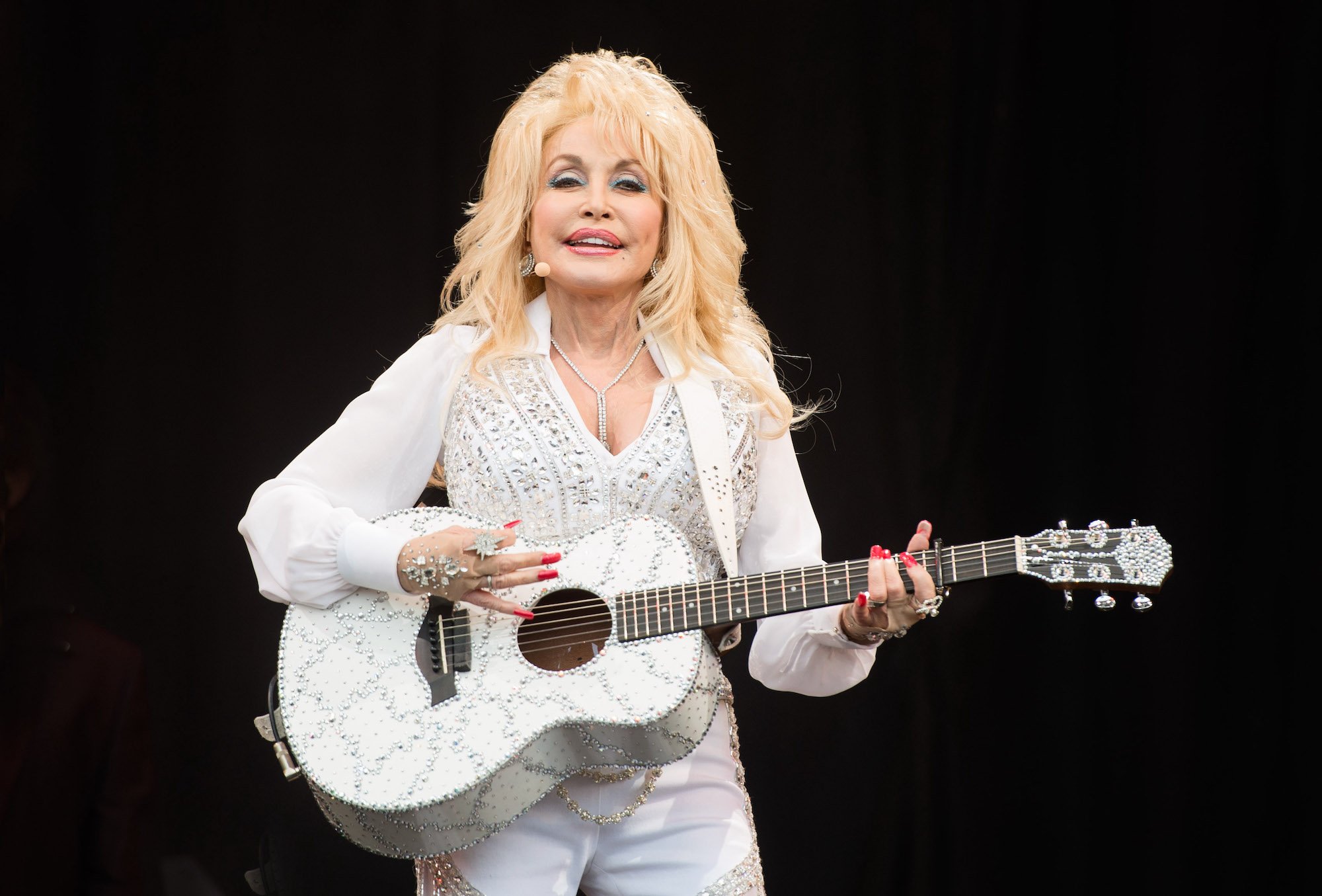 Dolly Parton performing onstage on Day 3 of the Glastonbury Festival in 2014