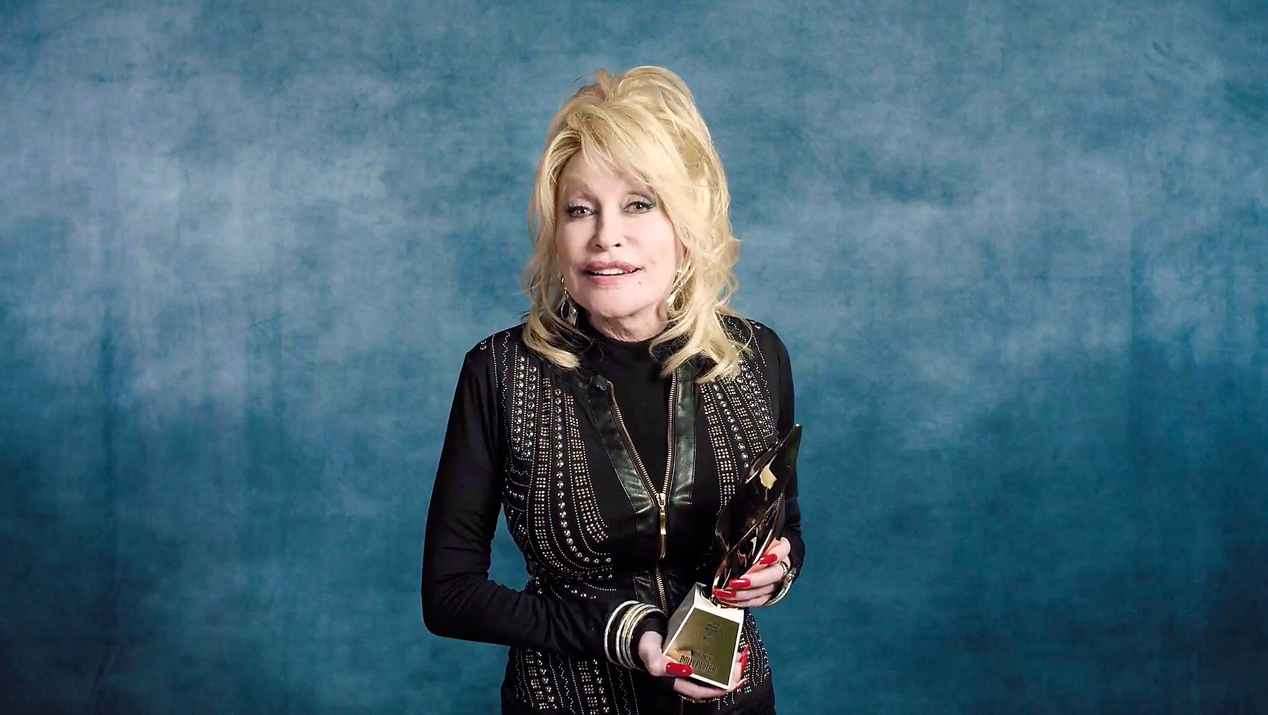 Dolly Parton accepts the Hitmaker Award during the Billboard Women In Music 2020 event on December 10, 2020.