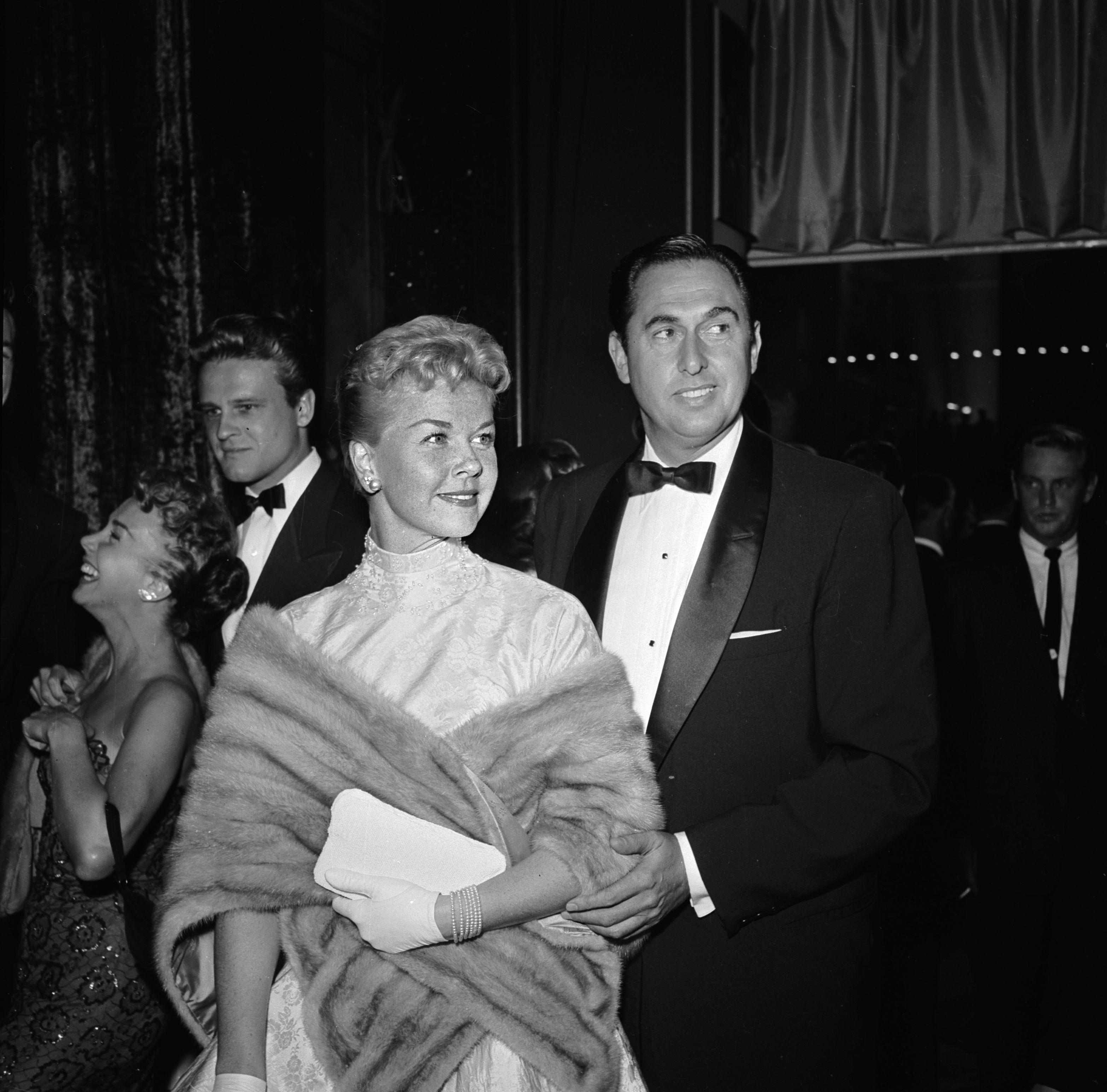 Doris Day with Marty Melcher at the film premiere of 'A Star Is Born' featuring Judy Garland.