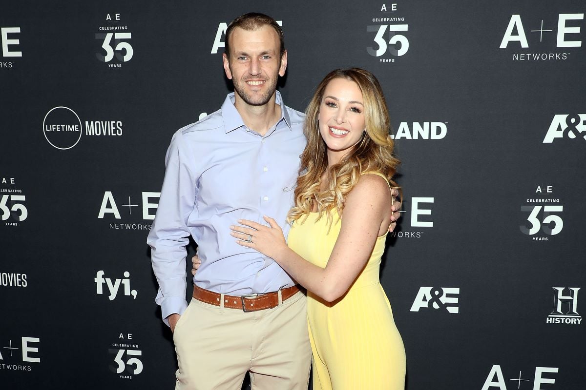 'Married at First Sight' couple Doug Hehner in a blue collared shirt and Jamie Otis in a yellow dress