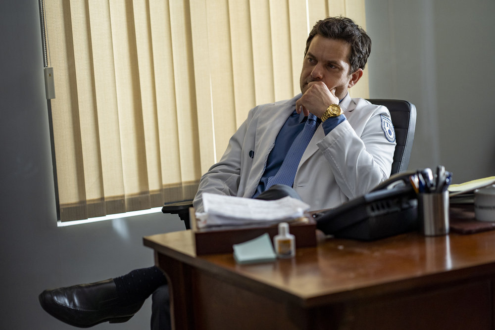 Joshua Jackson as Christopher Duntsch, wearing a lab coat, seated