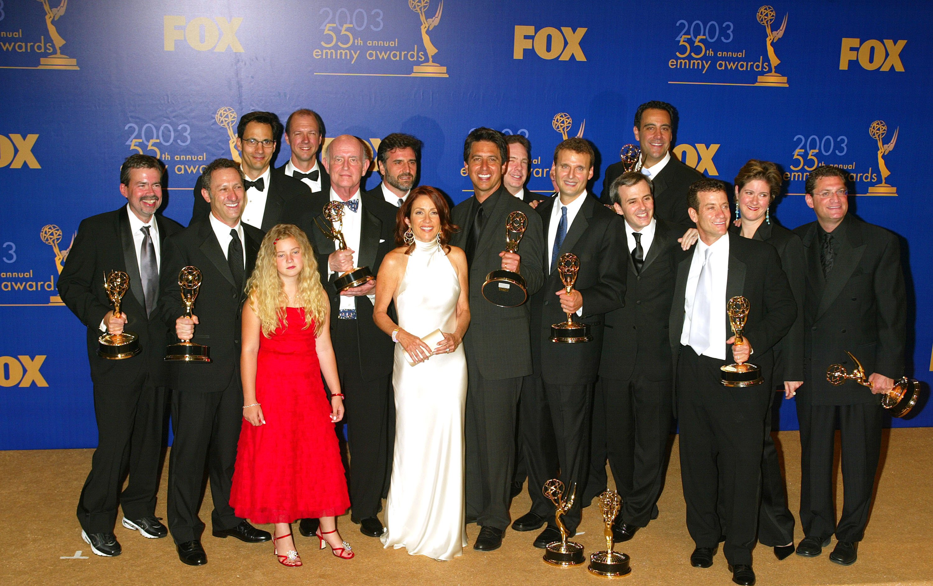 The cast of 'Everybody Loves Raymond' poses with the show's writers, producers, and Emmy awards in 2003