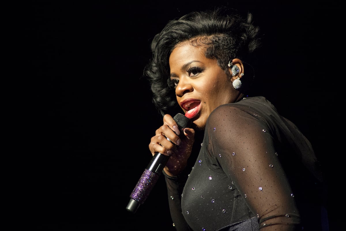 Fantasia singing into a mic