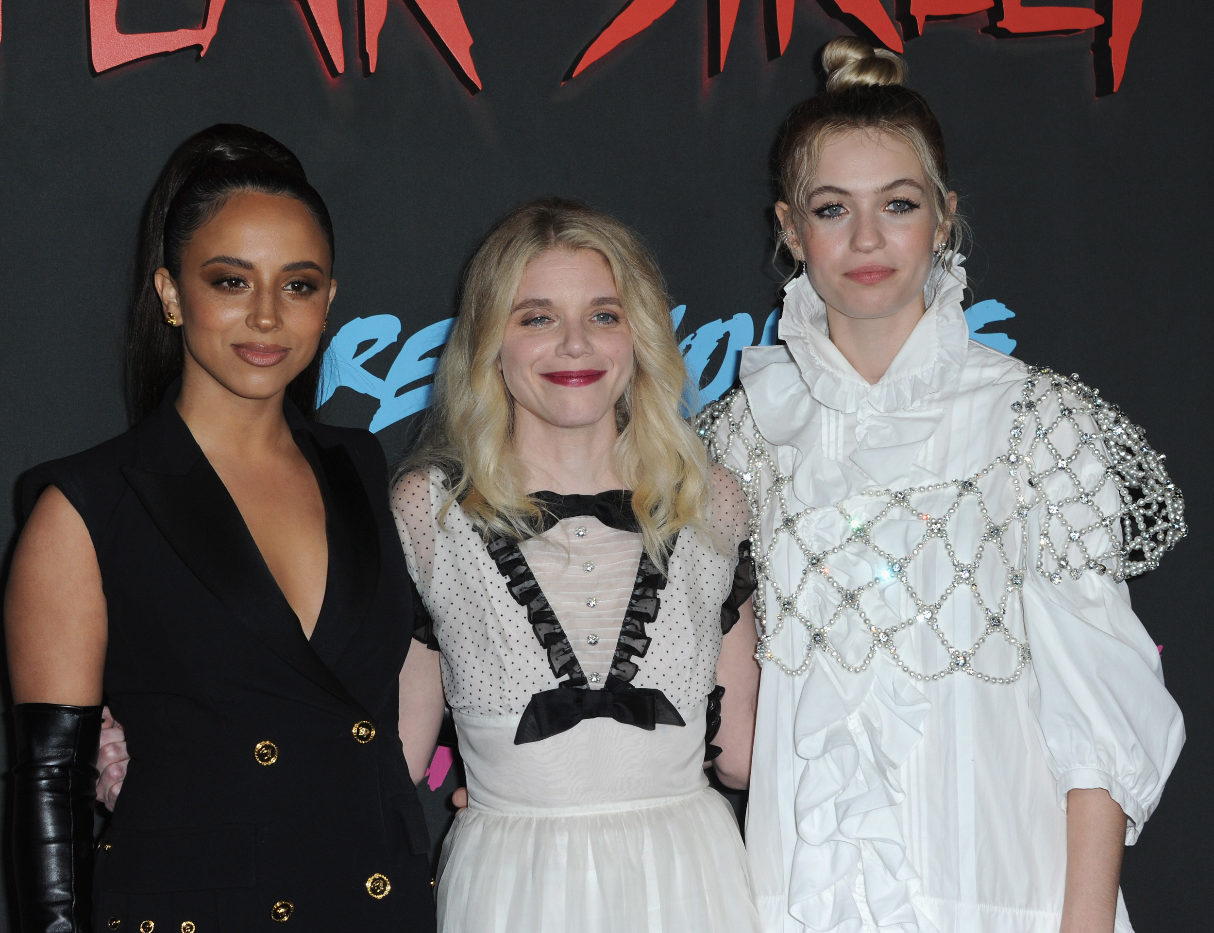 Kiana Madeira, Leigh Janiak, and Olivia Scott Welch wearing formal dresses at the Netflix premiere for the 'Fear Street' trilogy
