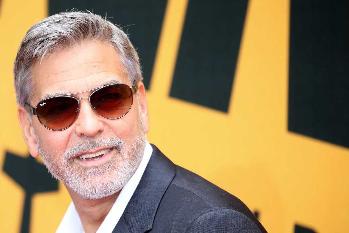 George Clooney wearing sunglasses on the red carpet