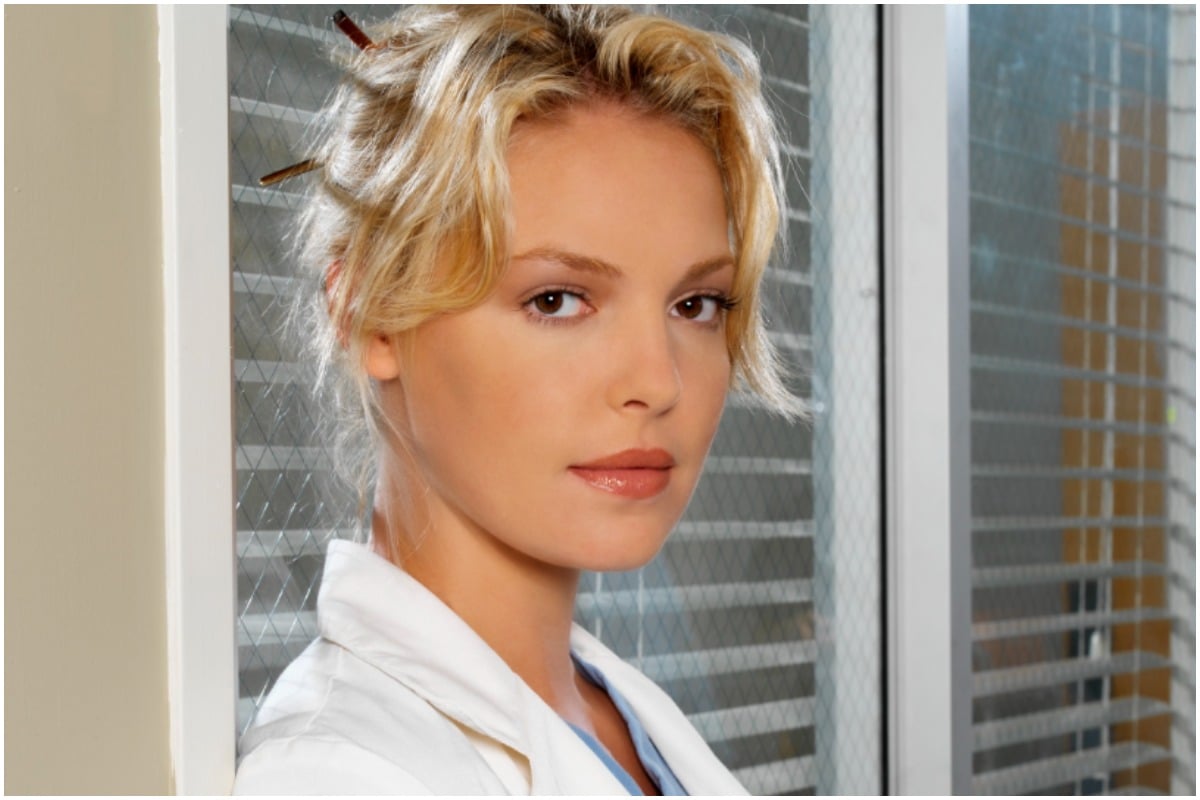 'Grey's Anatomy' star Katherine Heigl as Izzie staring intensely at the camera while wearing medical scrubs.
