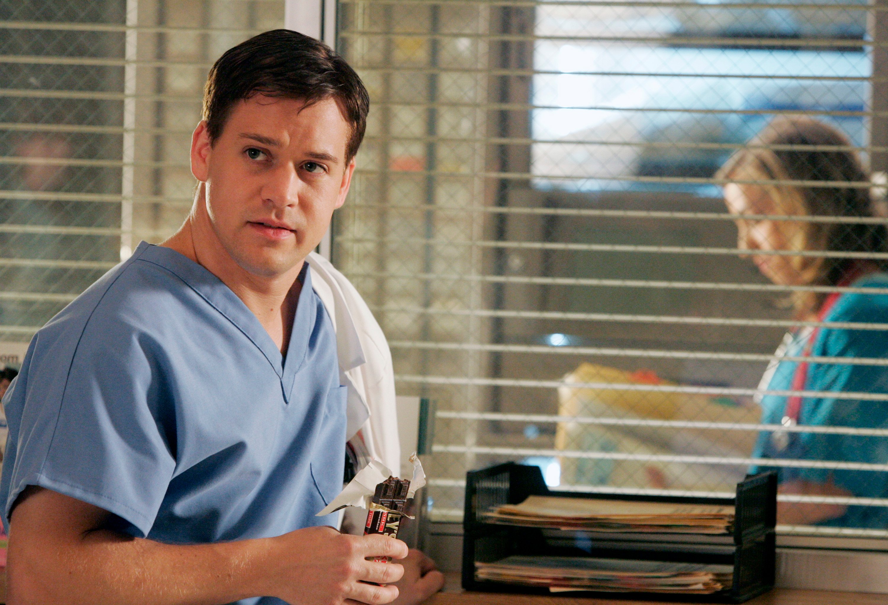 'Grey's Anatomy' actor T.R. Knight wearing light blue medical scrubs as George O'Malley.