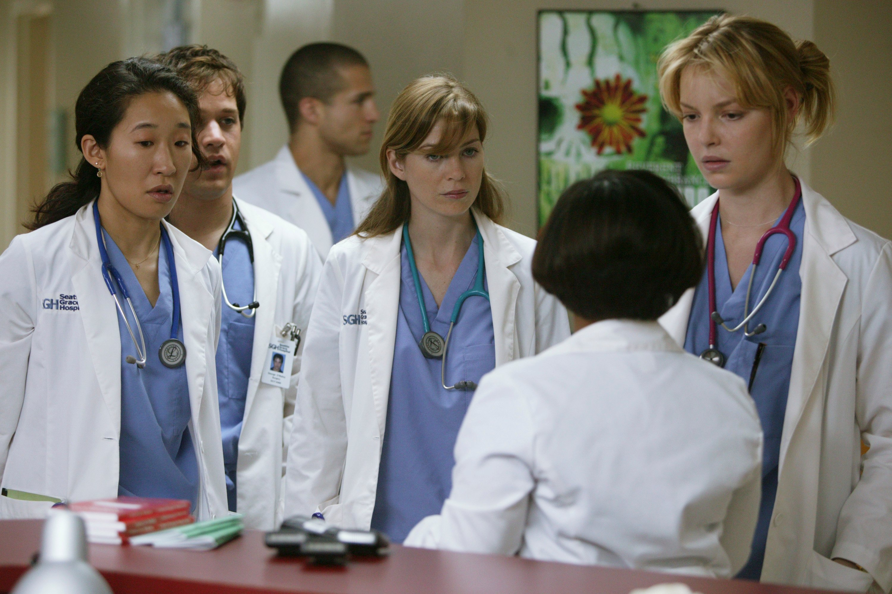 'Grey's Anatomy actors Ellen Pompeo, Sandra Oh, Katherine Heigl, T.R. Knight, and Chandra Wilson as Meredith, Izzie, Cristina, George, and Miranda Bailey filming the pilot.