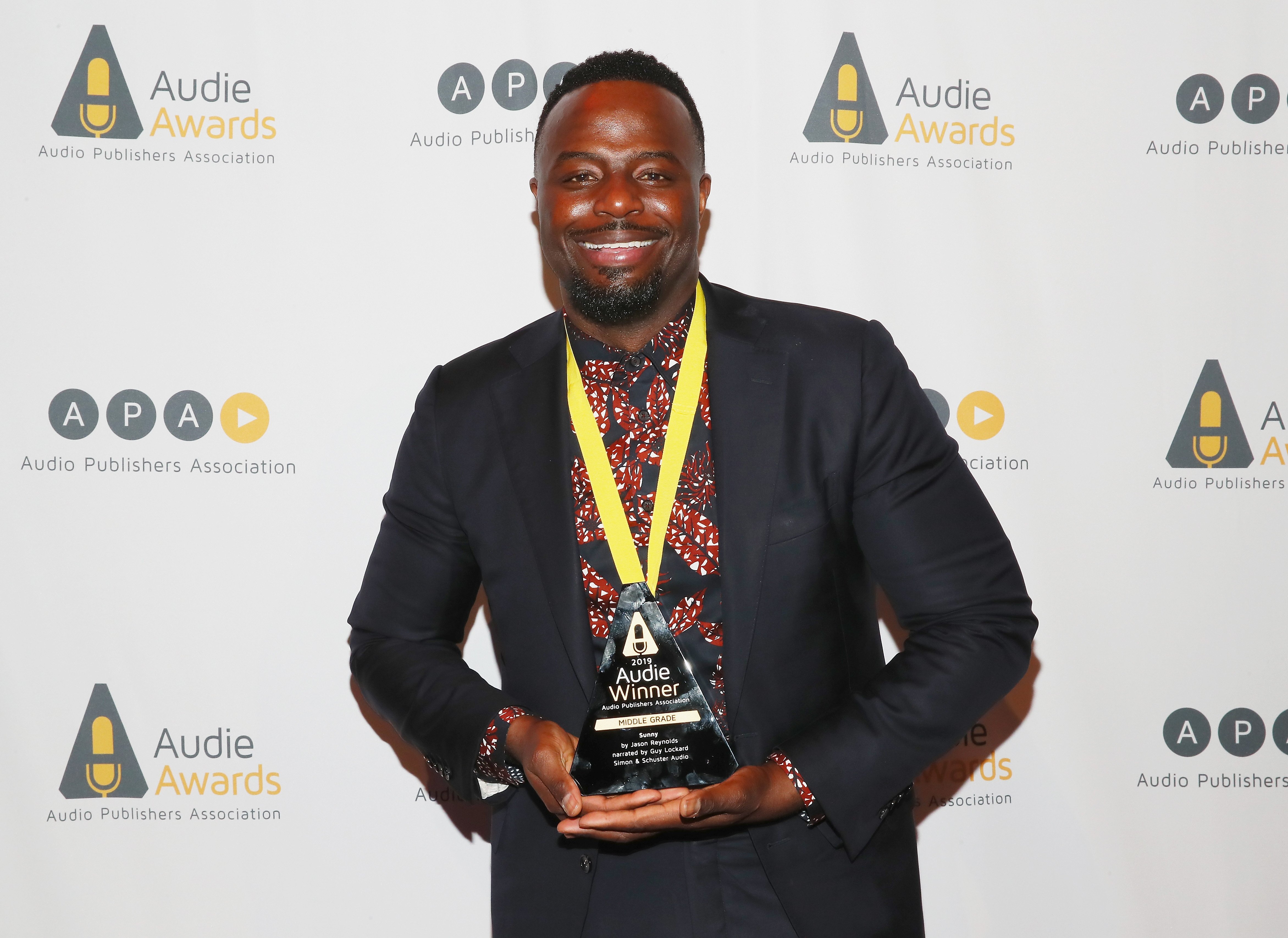 Guy Lockard holds an Audie Award