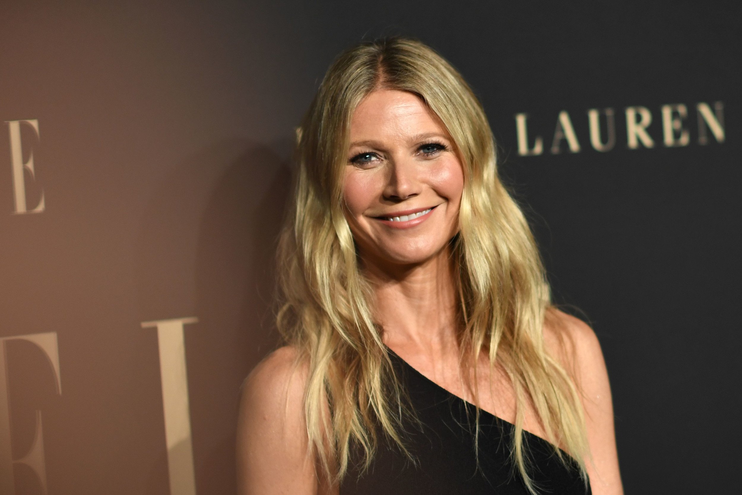 Gwyneth Paltrow wearing a black, off-the-shoulder dress on the red carpet