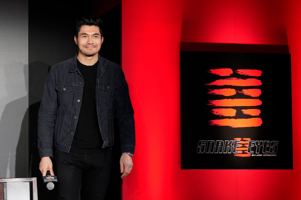 Henry Golding poses at a red carpet even celebrating the production start for ‘Snake Eyes’