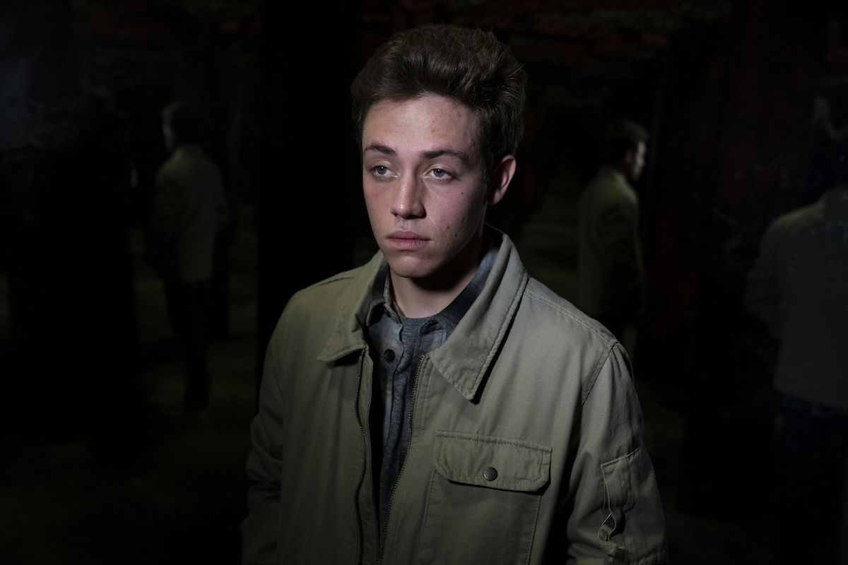 Ethan Cutkosky as Henry Mesner against dark backgroun in episode of 'Law & Order: SVU'