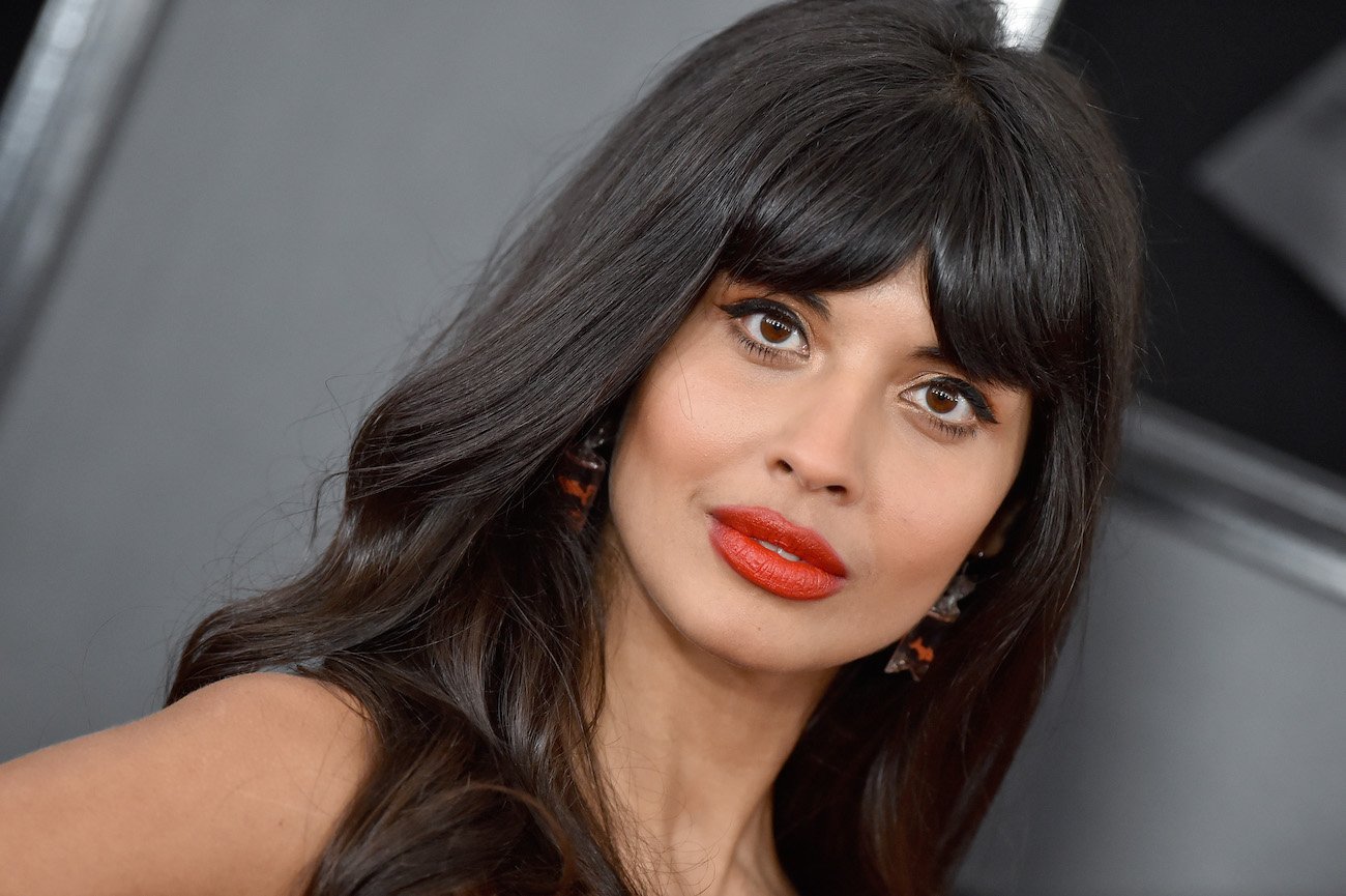 Jameela Jamil looking on, close up