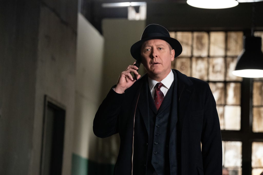 James Spader as Raymond 'Red' Reddington looks concerned as he talks on the phone.