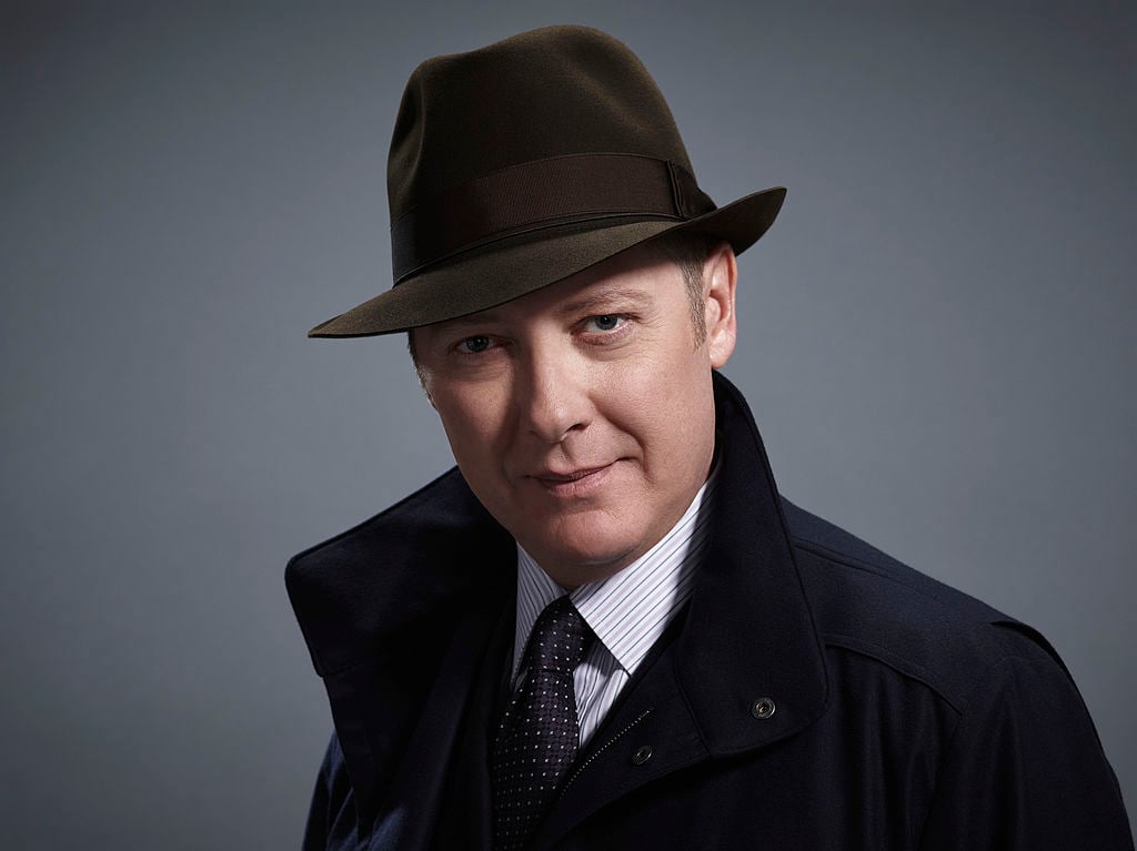 James Spader as 'Red' Raymond Reddington in his trademark hat and overcoat.