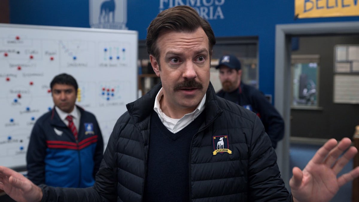 Jason Sudeikis stands in the locker room as Ted Lasso on 'Ted Lasso'