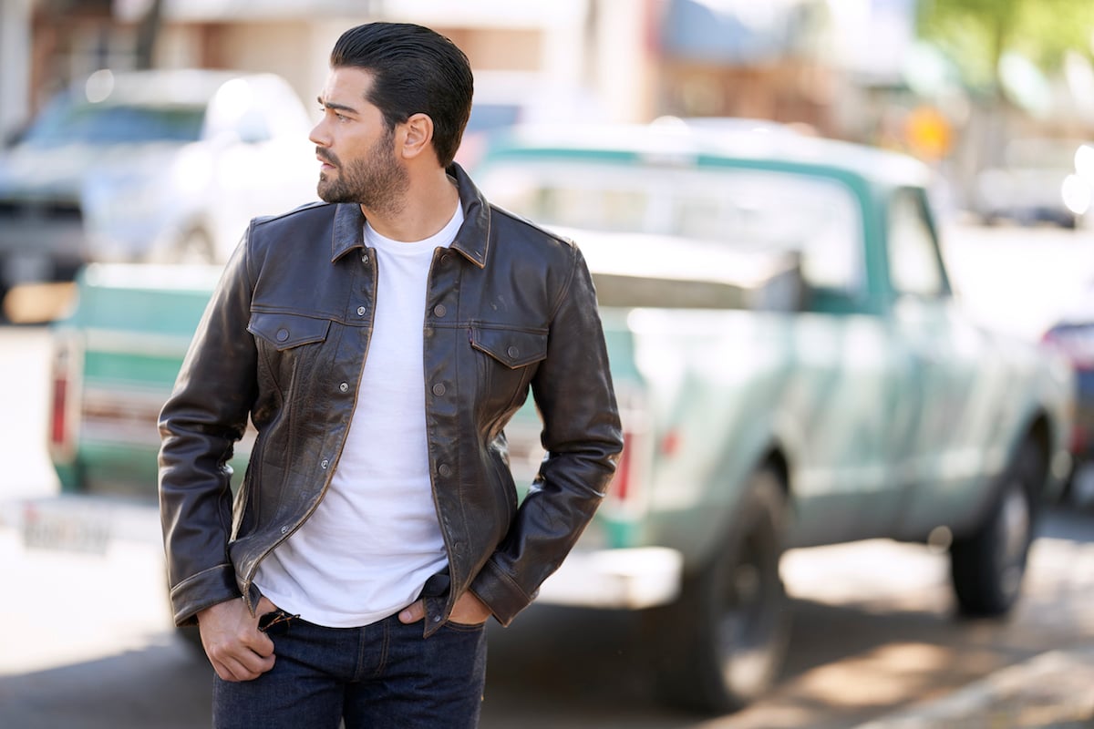 Jesse Metcalfe, looking over his shoulder, in an episode of 'Chesapeake Shores'