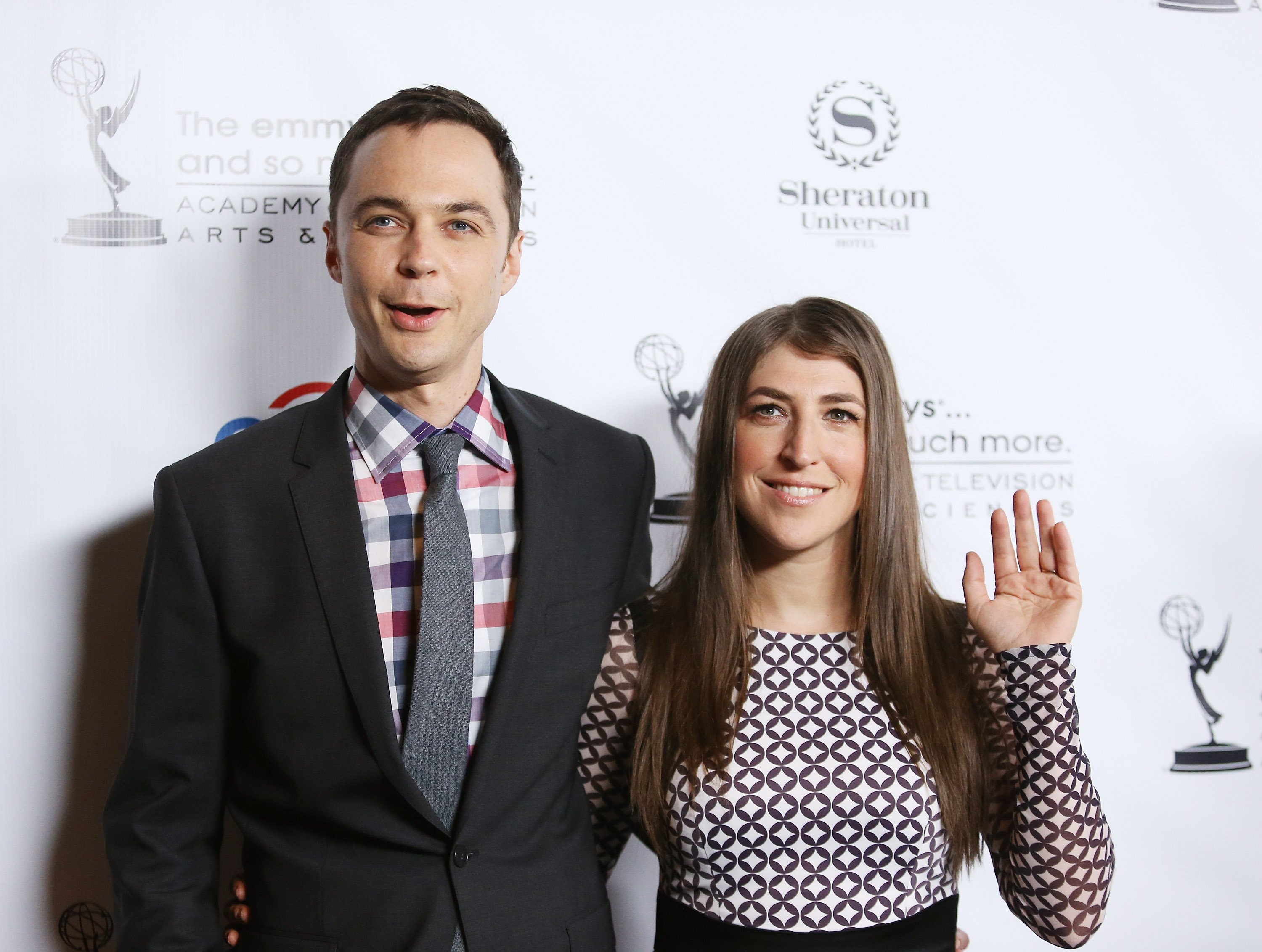 Jim Parsons and Mayim Bialik pose for a photo after arriving at the Academy of Television Arts $ Sciences' Performers Peer Group cocktail reception