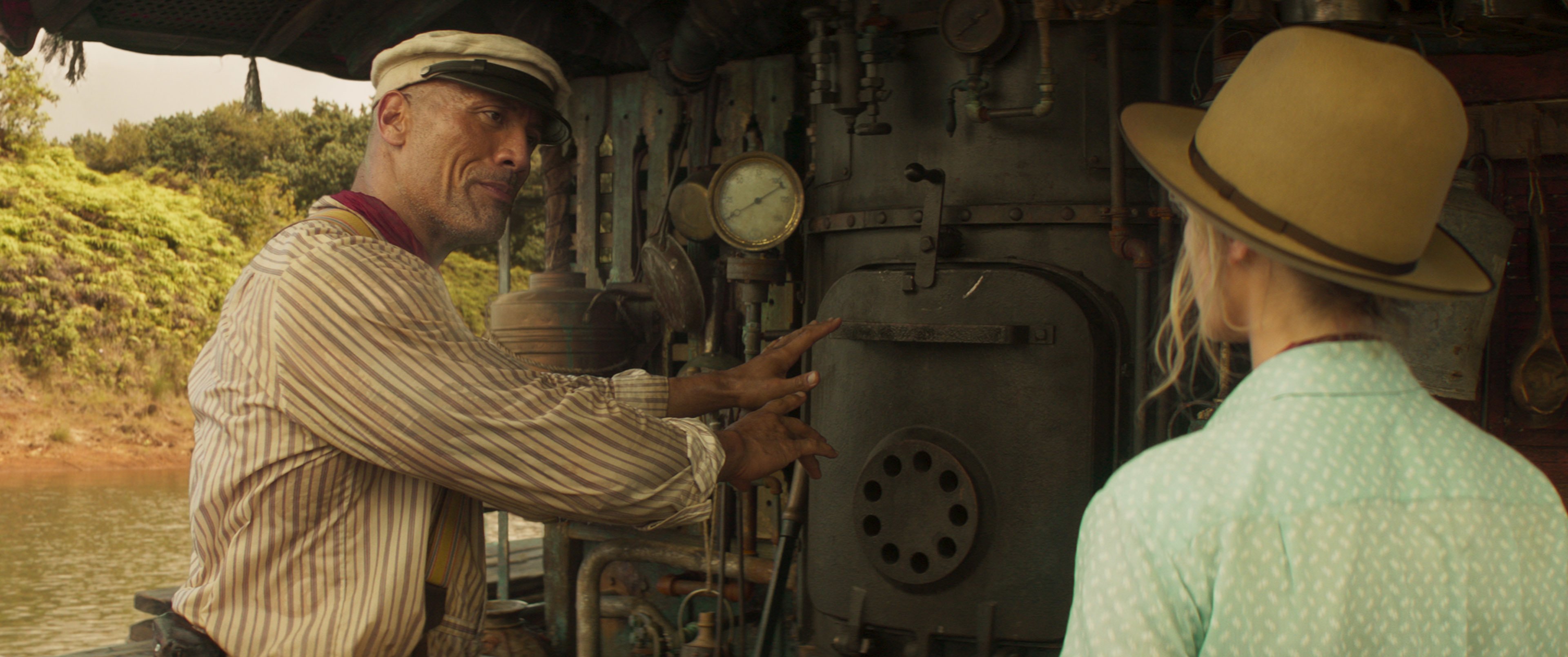 Jungle Cruise captain Dwayne Johnson fixes the engine