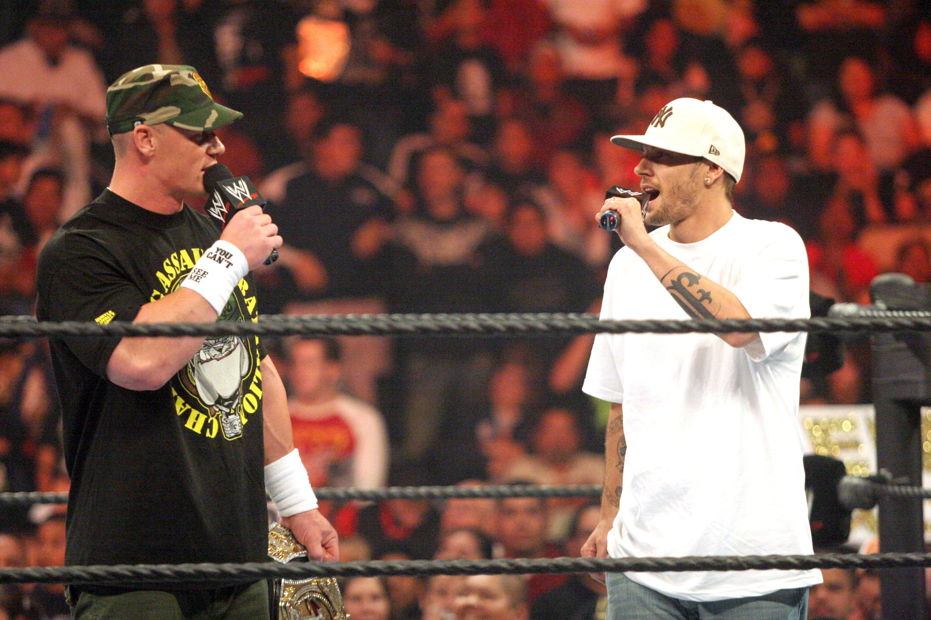John Cena and Kevin Federline during WWE Monday Night Raw talking to each other using mics