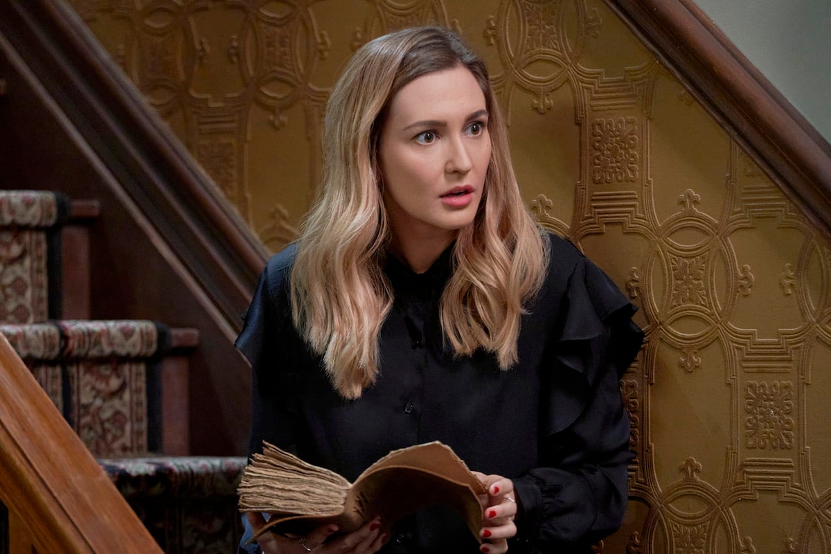 Katherine Barrell holding a book and looking confused in the 'Good Witch' series finale