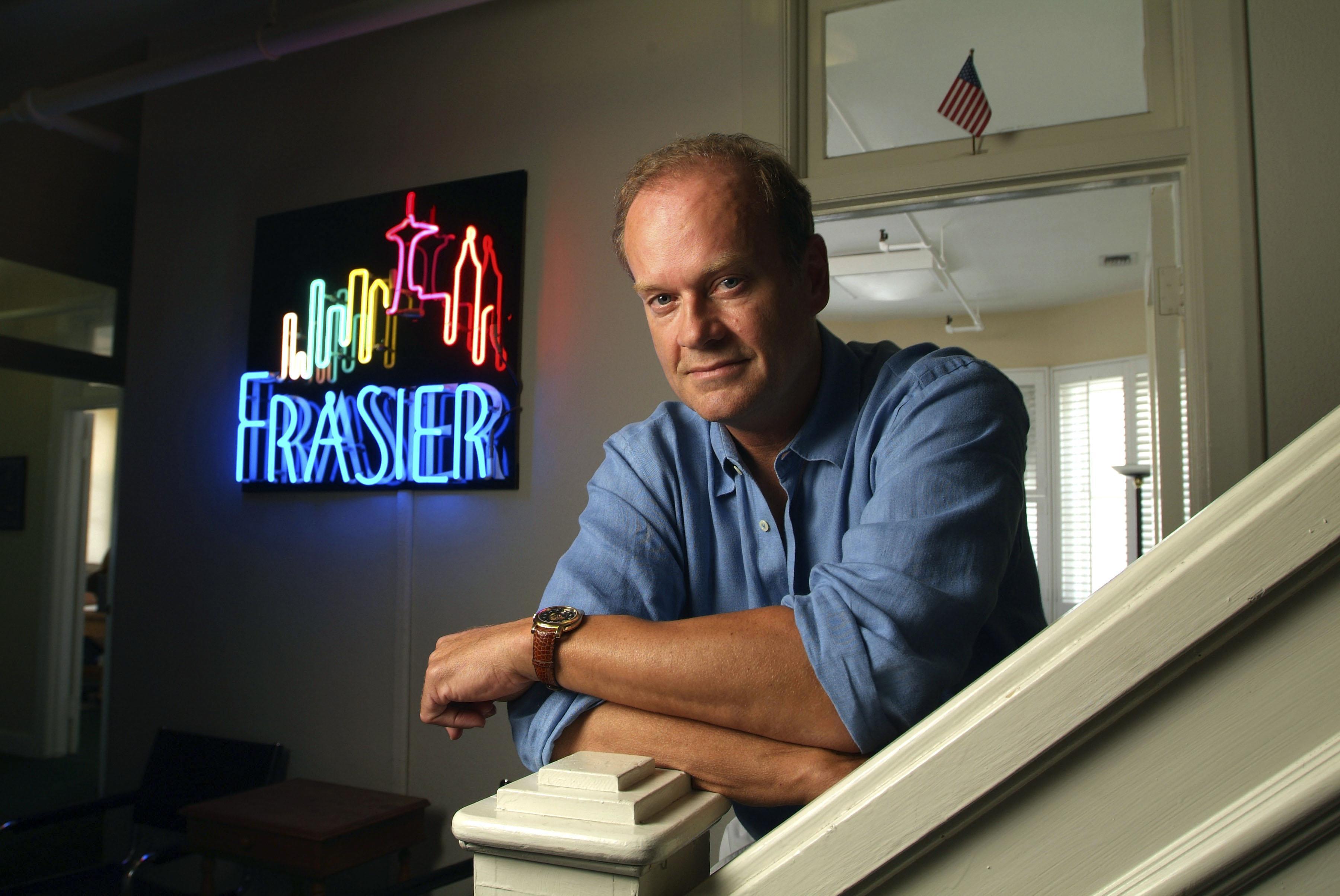 Kelsey Grammer stands in front of a sign for his famed show, 'Frasier', at his office at Paramount Studios