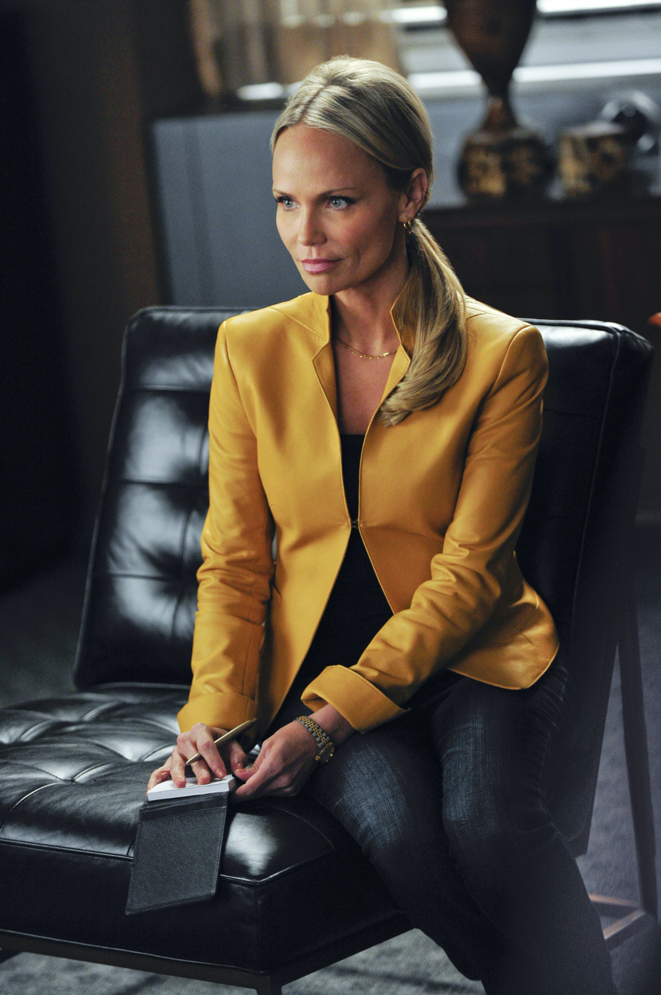 Kristin Chenoweth sitting in a scene from 'The Good Wife'
