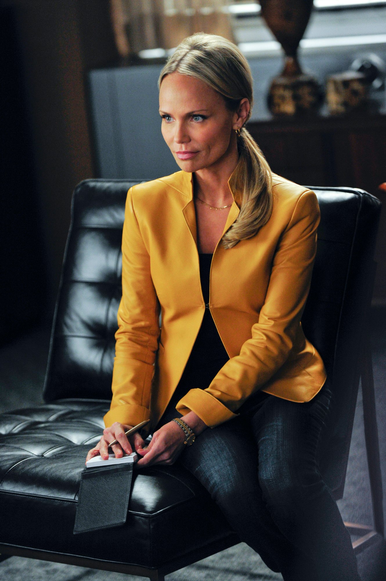 Kristin Chenoweth sitting in a scene from 'The Good Wife'